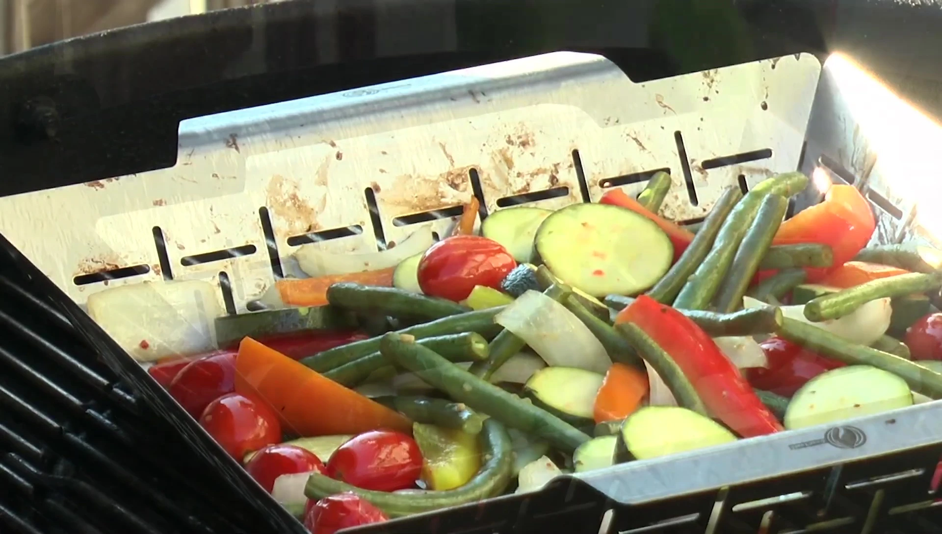 Seasoning the grilled vegetables with salt and pepper.
