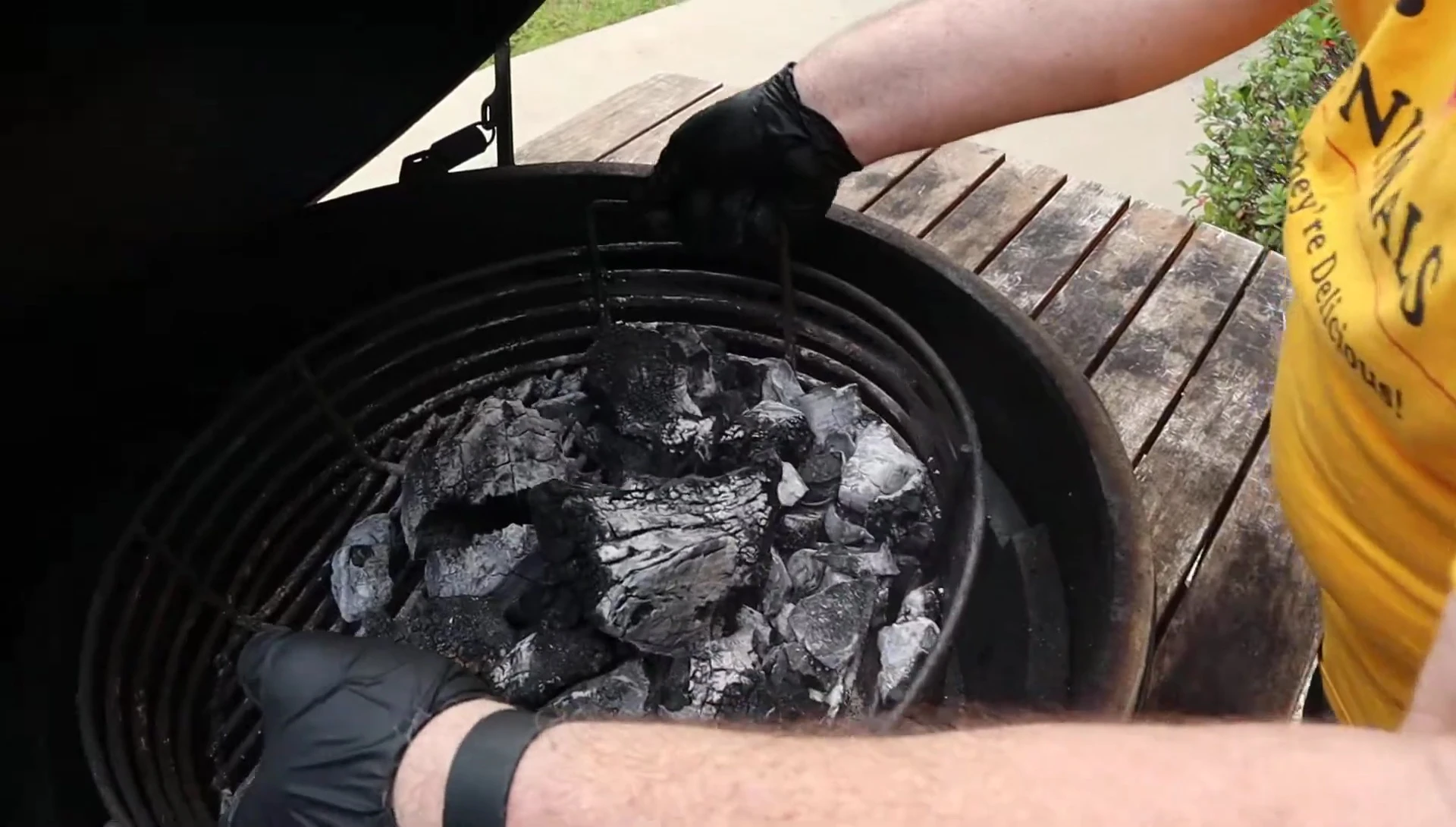 Shaking ash from the Kick Ash Basket