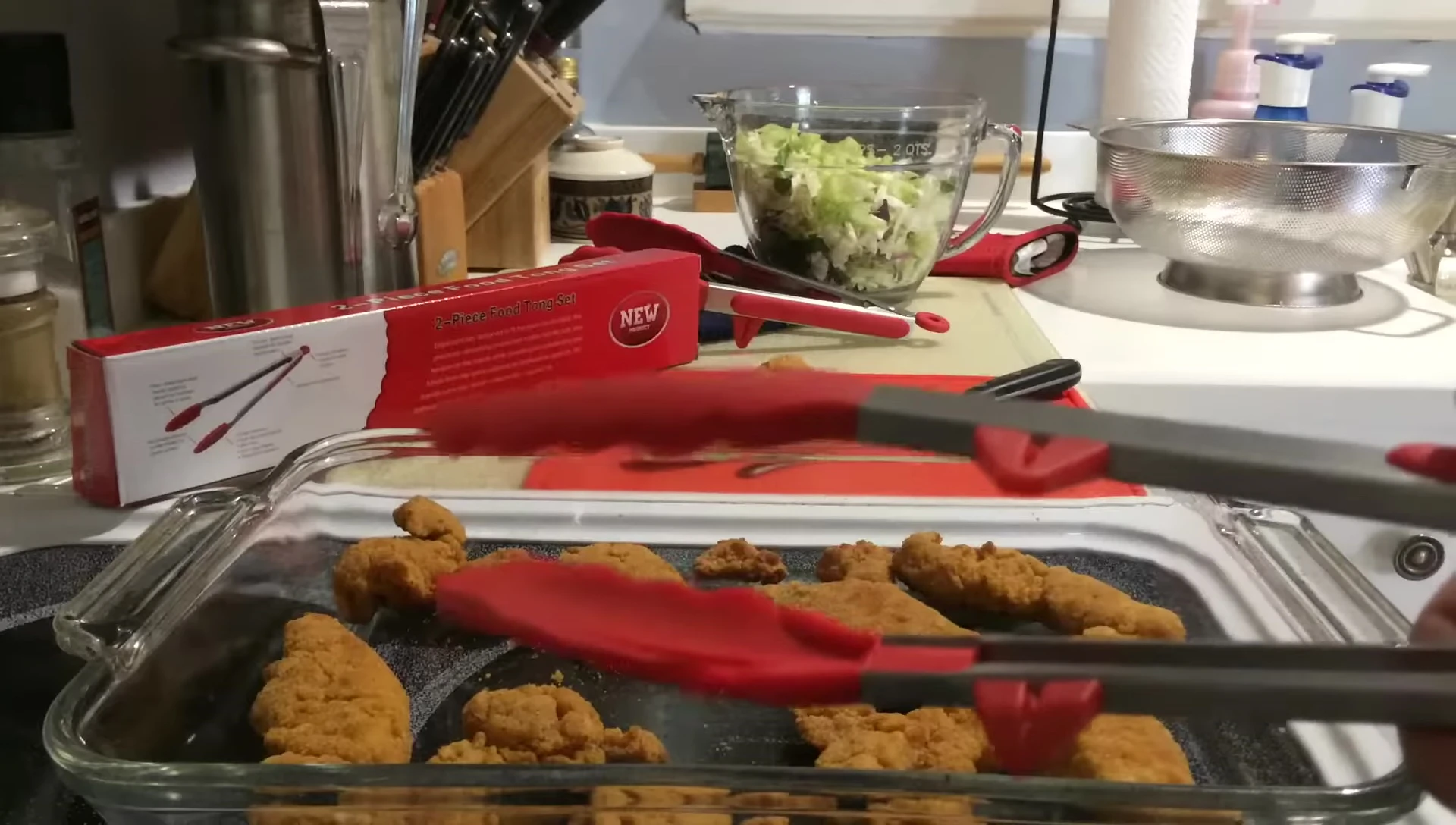 Close-up showing the feet on the tongs.