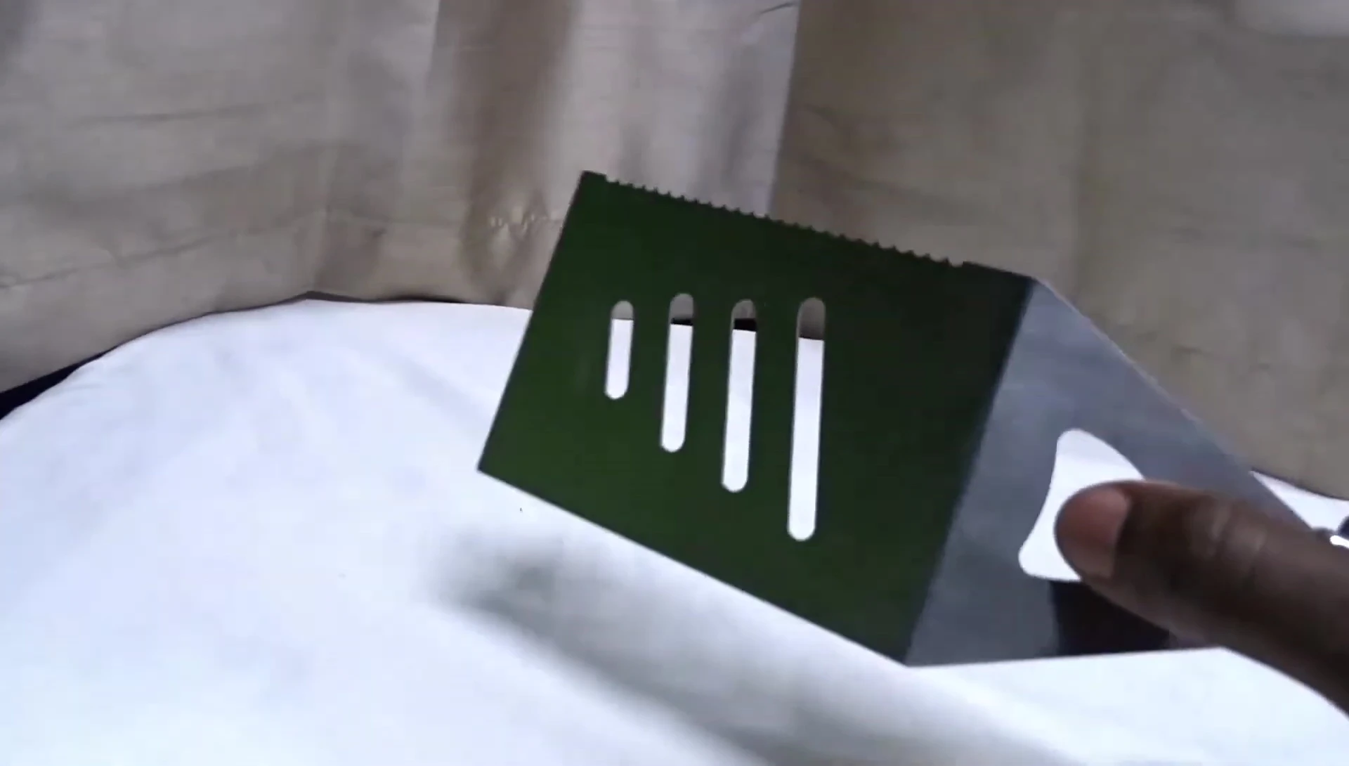 The bottle opener feature on the spatula's handle.
