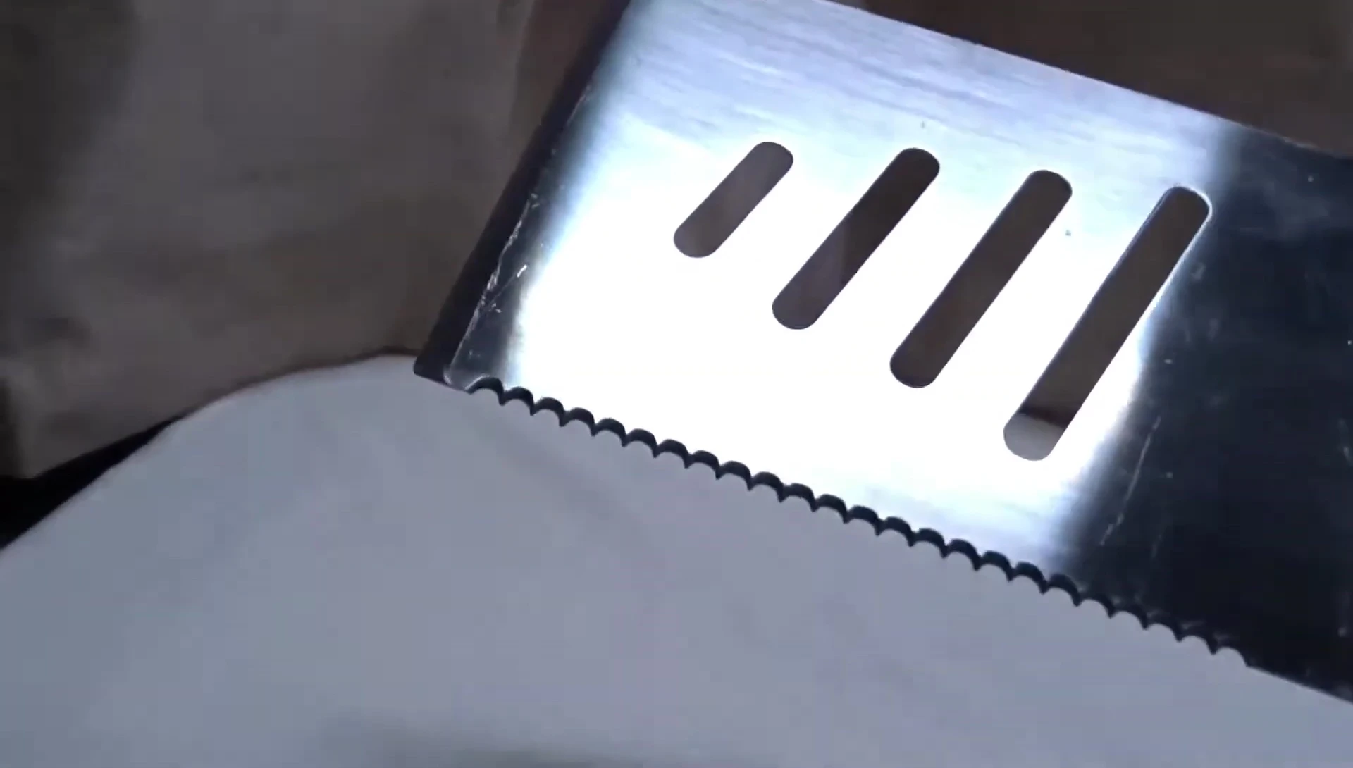 Close-up of the sharp edge of the spatula.