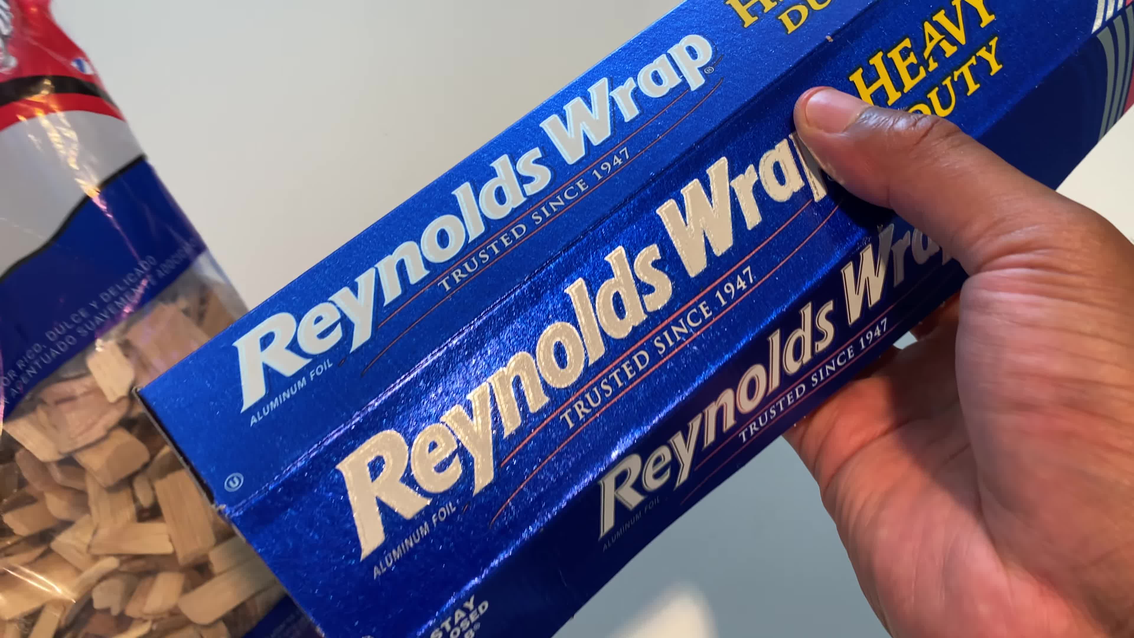 Speaker emphasizes using heavy-duty aluminum foil.