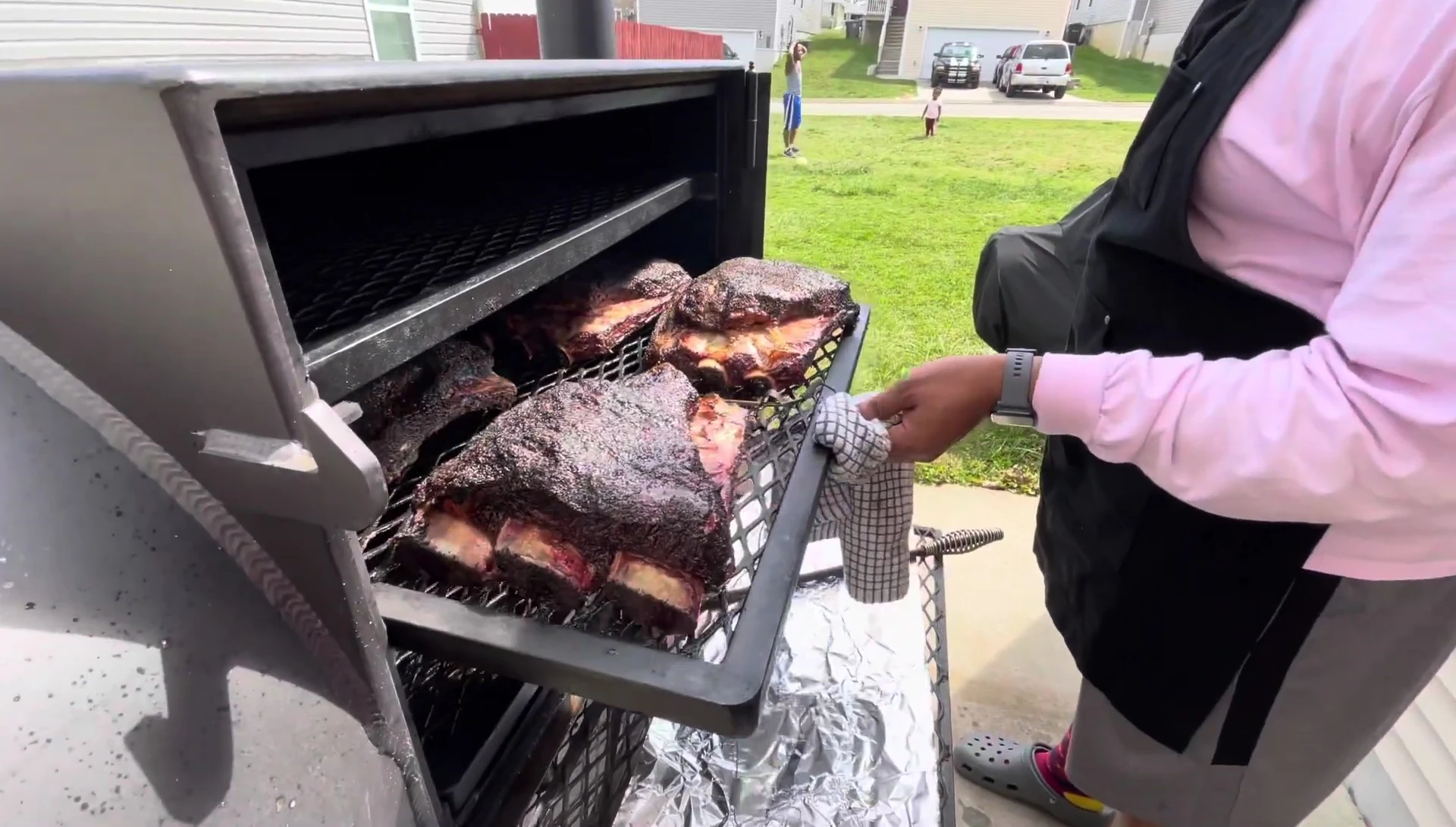 The cooked ribs are shown with the meat easily pulling off the bone.