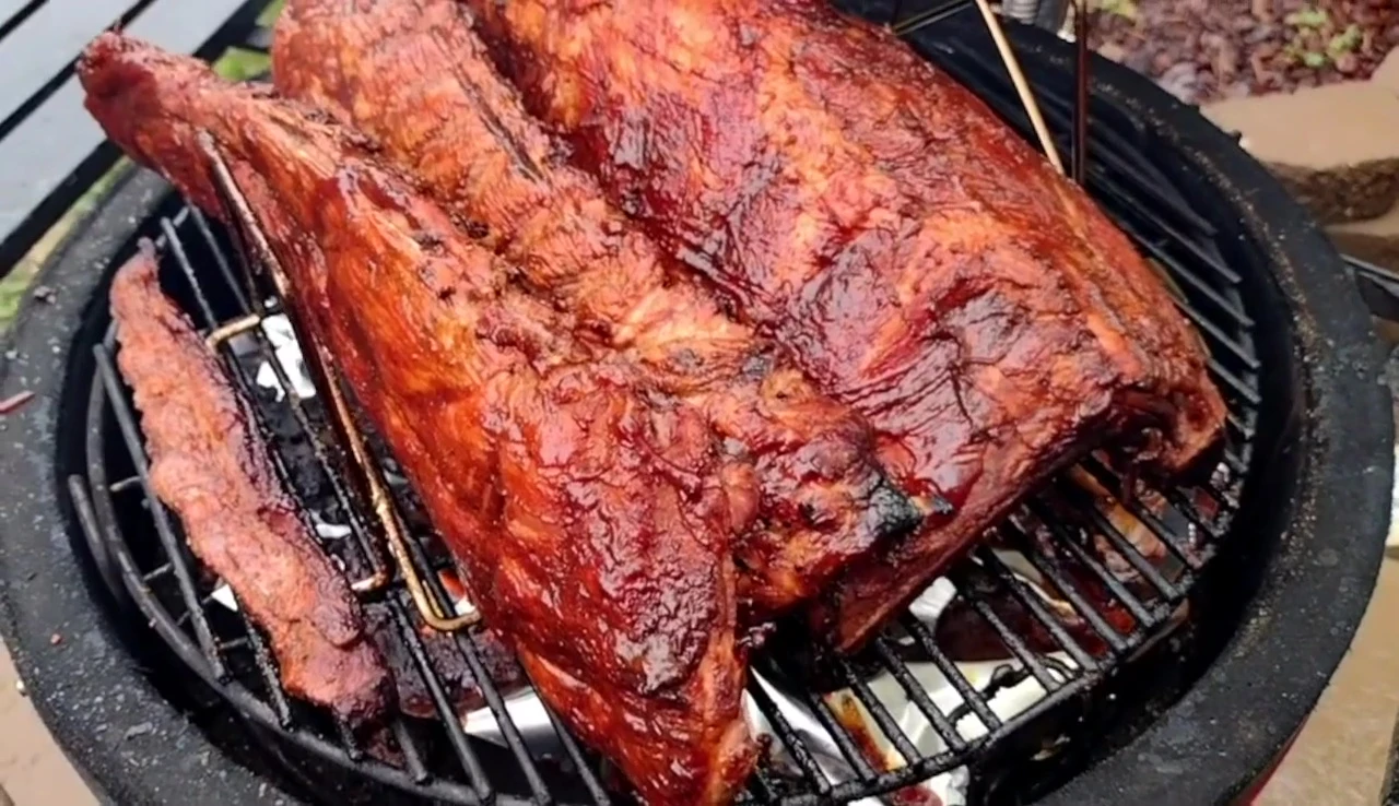 The Char-Broil rib rack loaded with ribs, demonstrating its capacity.