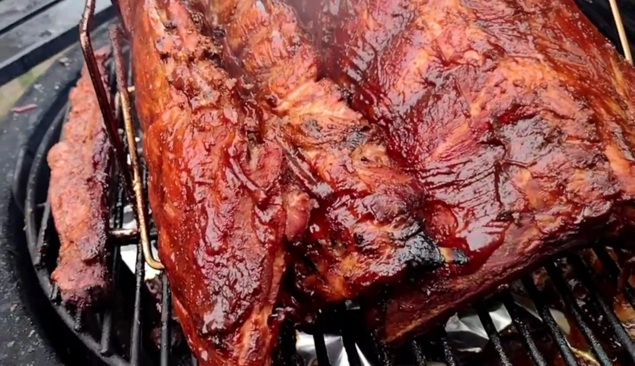 The Char-Broil rib rack in the Kamado Joe, showing the placement of ribs.
