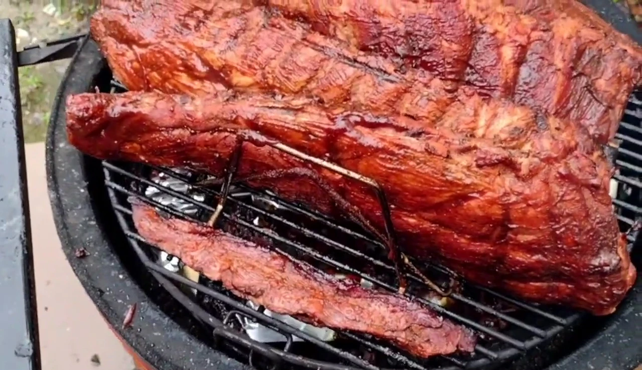 A shot of the reviewer expressing satisfaction with the Char-Broil rib rack.
