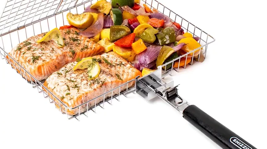 The stainless steel folding grilling basket with its foldable handle.