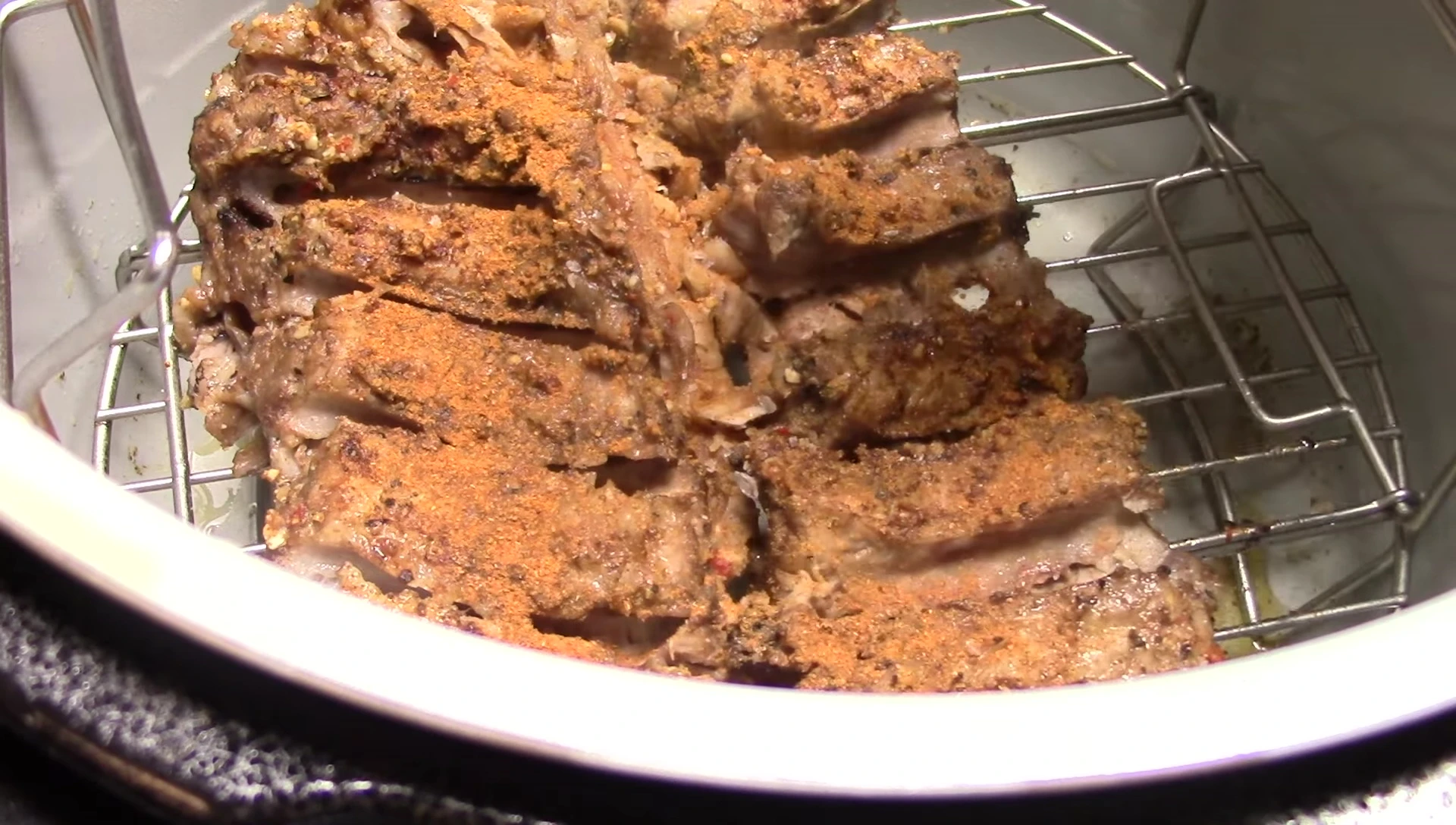 Adding barbecue sauce to the ribs.
