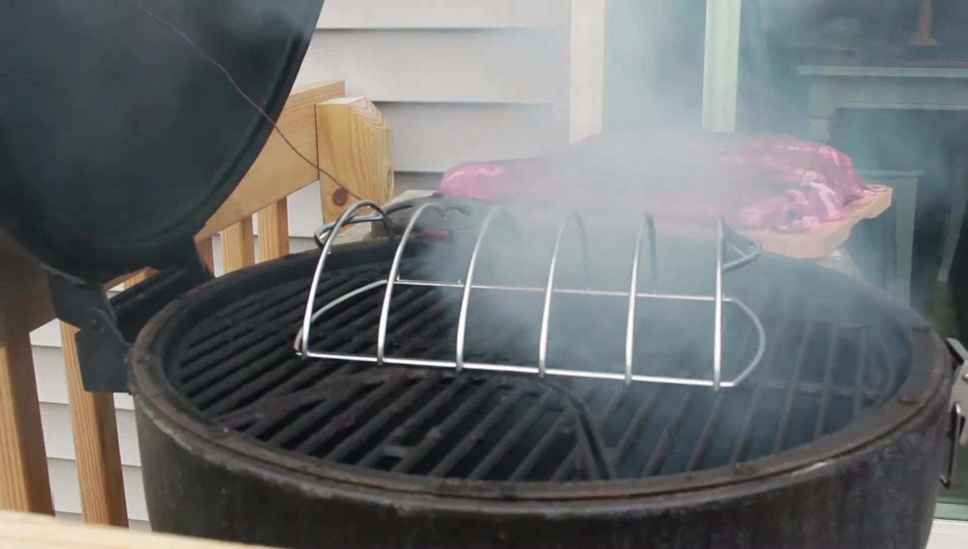 Smoker with ribs on the Weber rib rack.