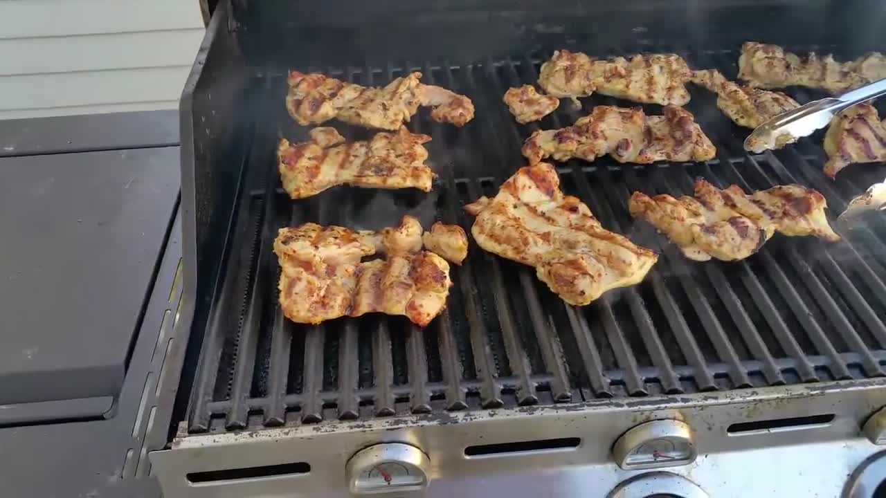 Close-up of the original metal grates on the Charbroil infrared grill.