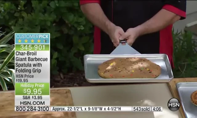 Spatula lifting a large baking sheet