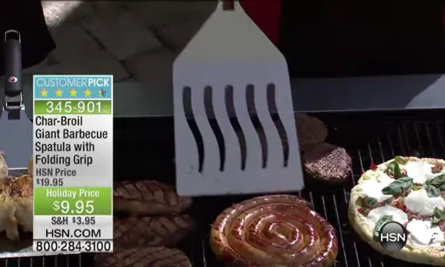 Spatula lifting a large coil sausage