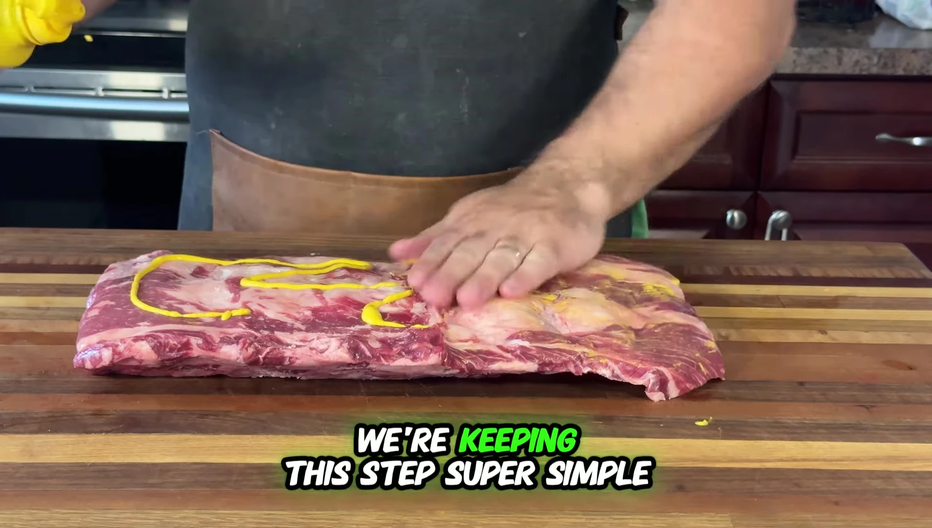 Salt and pepper being added to the ribs