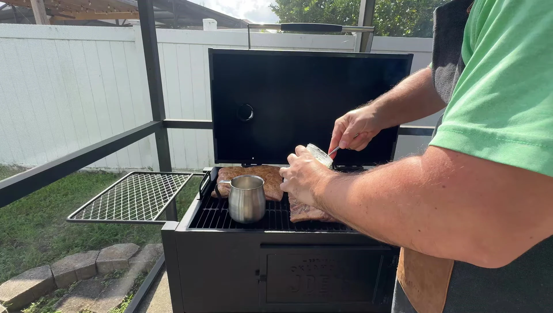 Pan of beef tallow in the smoker