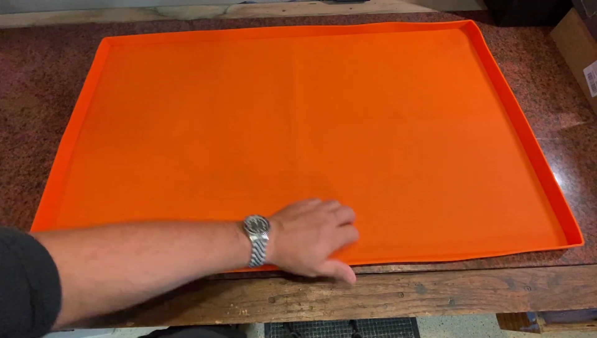 Close-up of the griddle mat's surface showing the sealing technology.