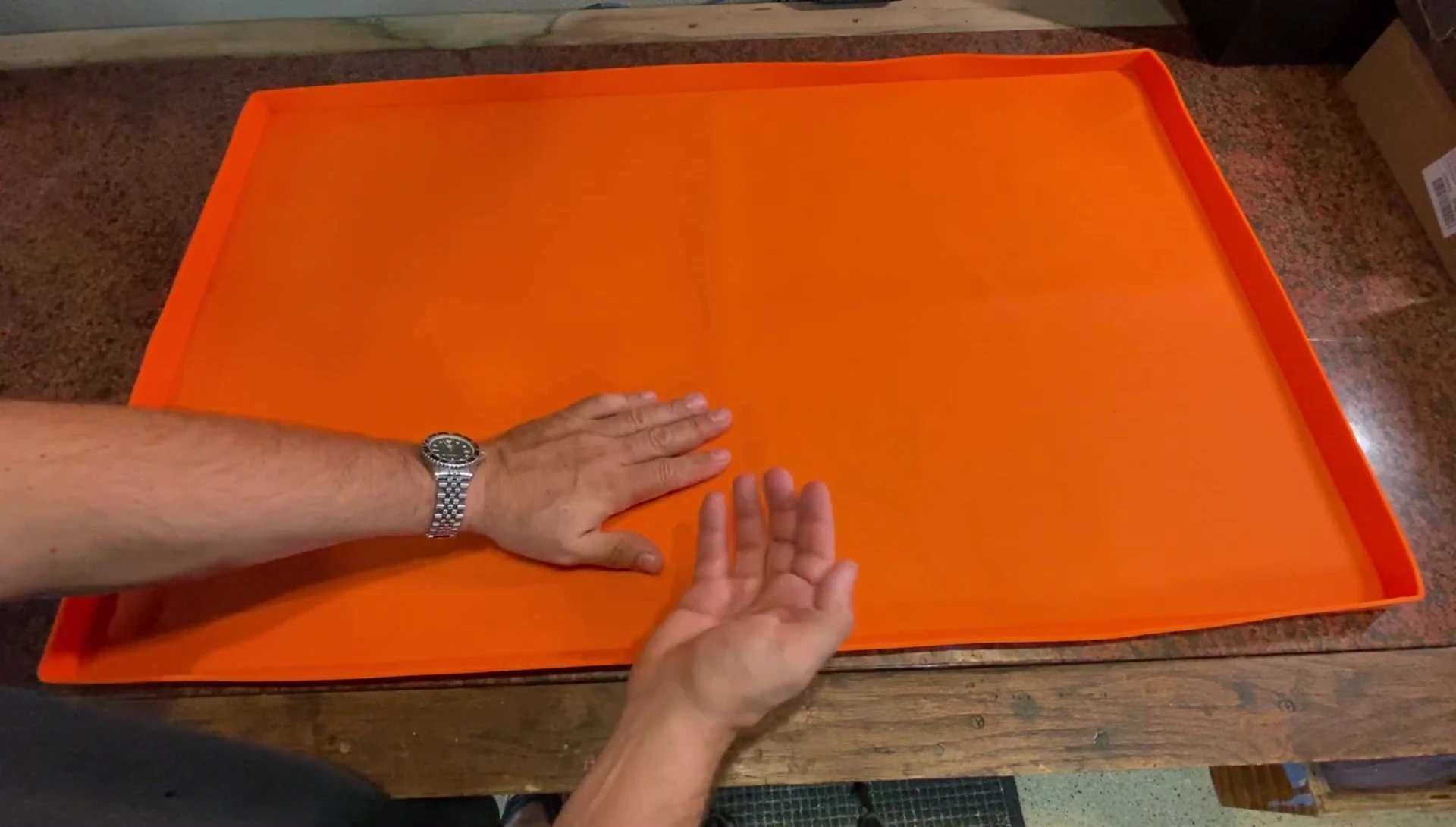 Detail shot highlighting the raised lip around the mat's edges.