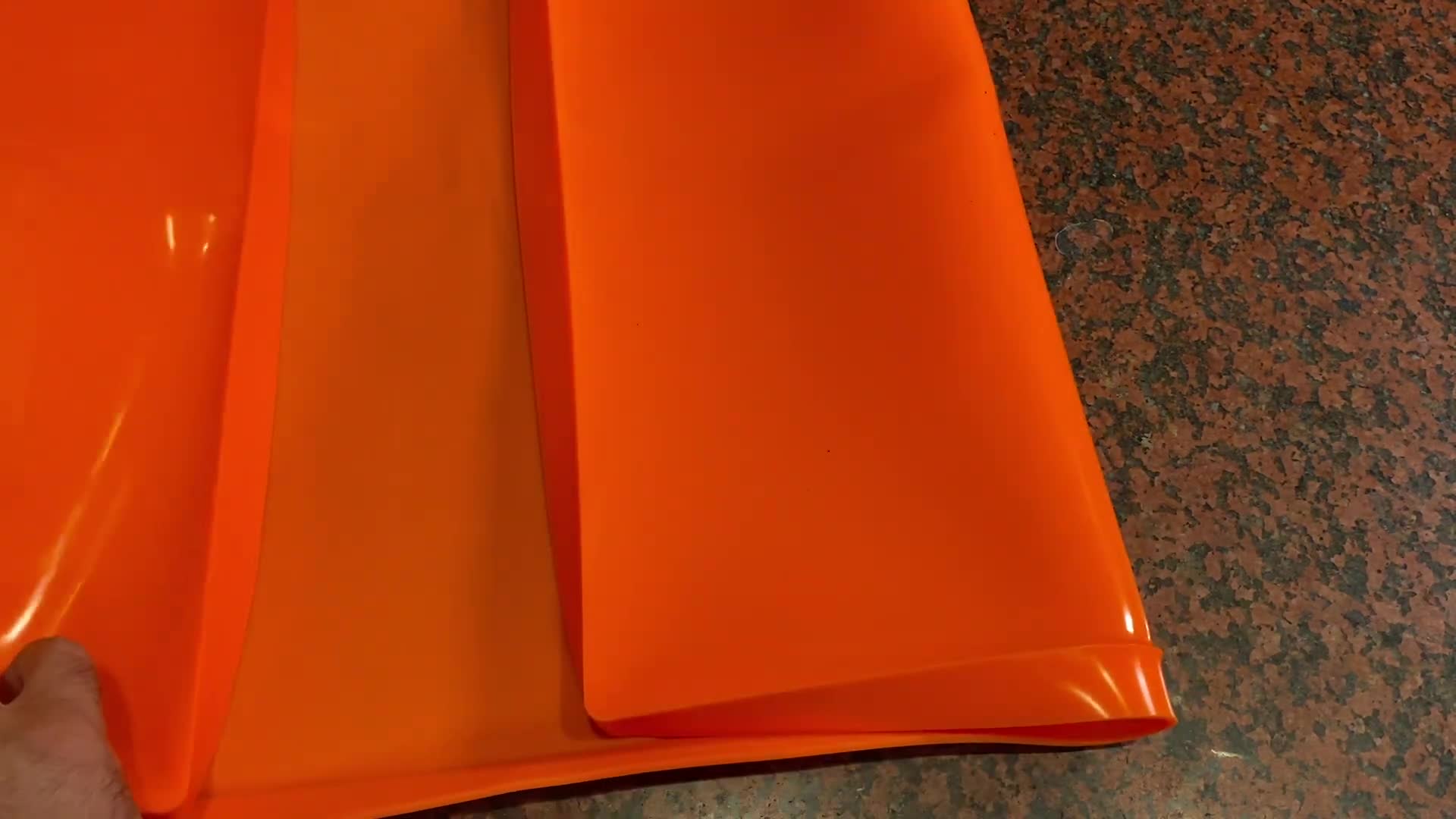 Griddle mat unboxing, showing the mat's size and packaging.