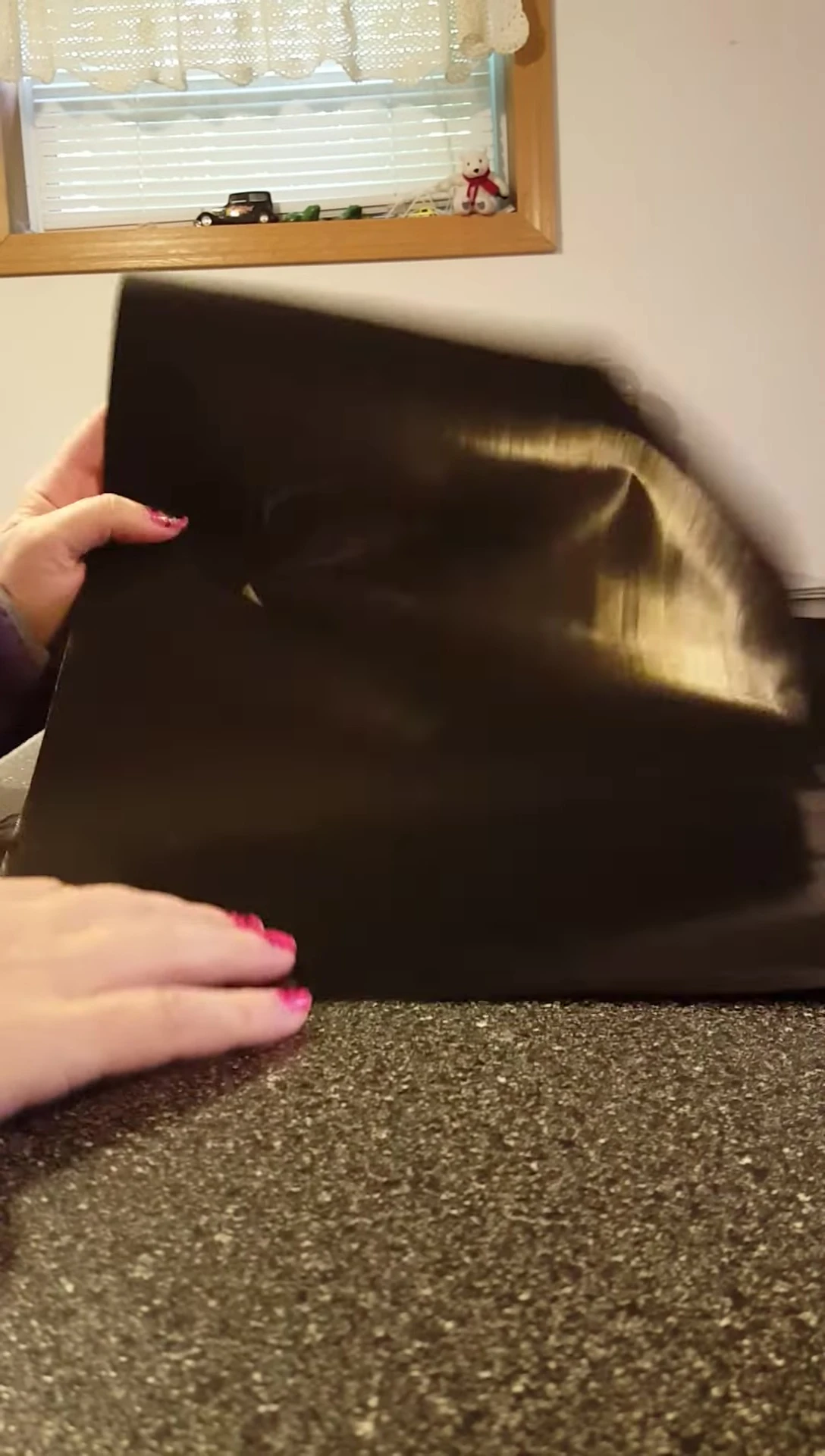 Demonstrating the non-stick nature of the mat