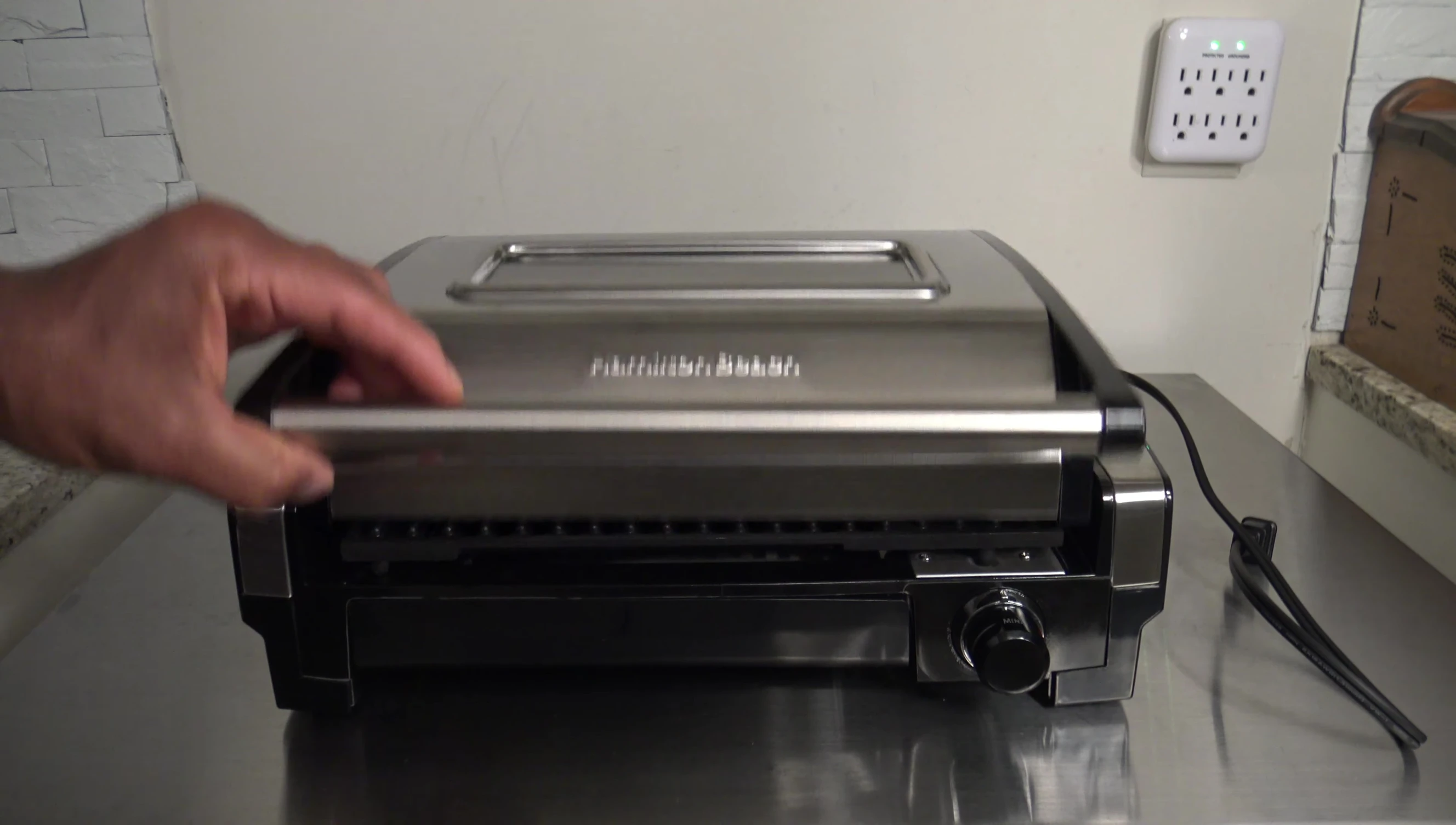 Measuring the grill's height with the door open