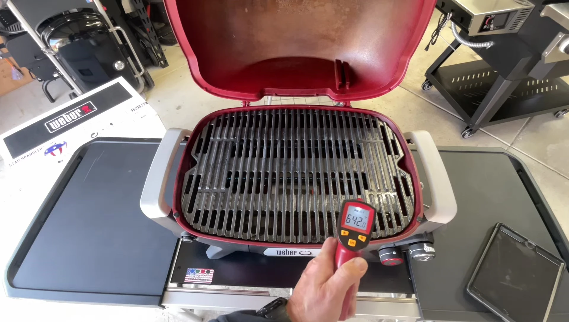Infrared thermometer measuring the grill temperature