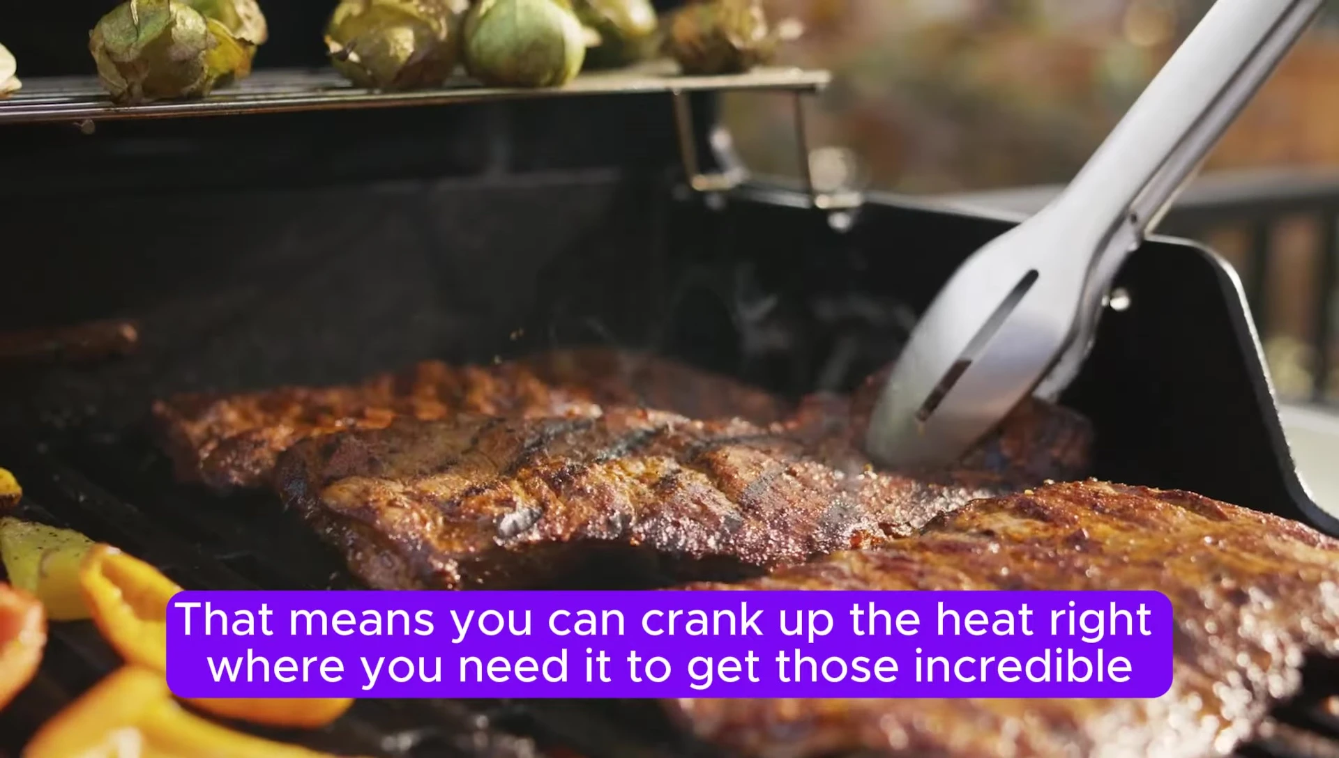 Image showcasing perfectly seared steaks on the Weber Spirit E-425 grill.