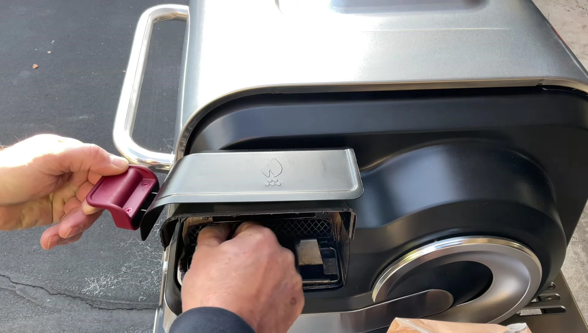 Adding more pellets to the hopper