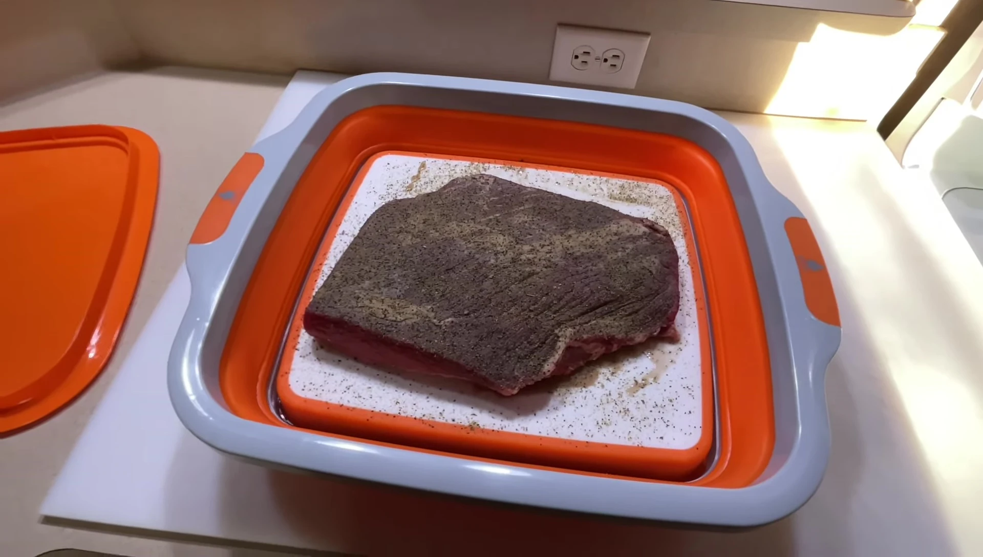 The grill setup with the drip pan and water is shown.