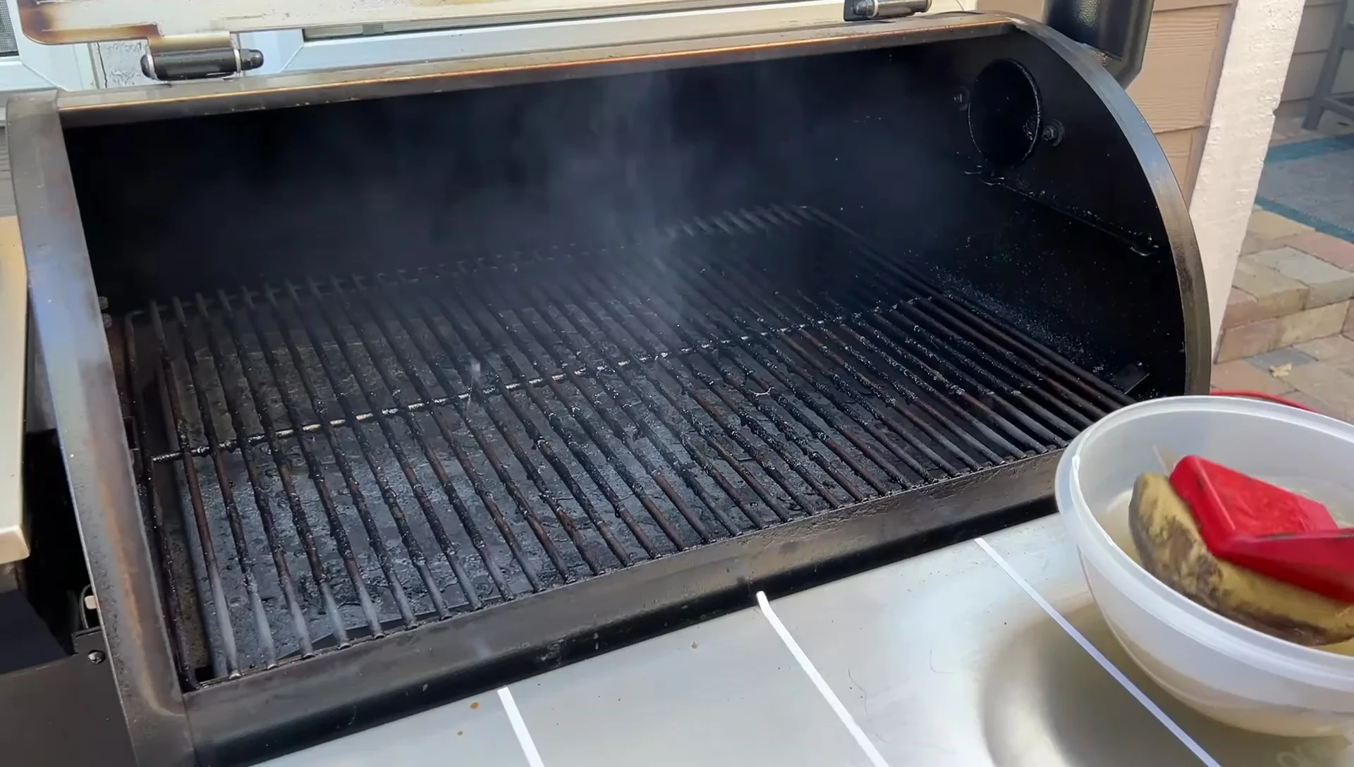 Grill Rescue brush cleaning a hot grill.