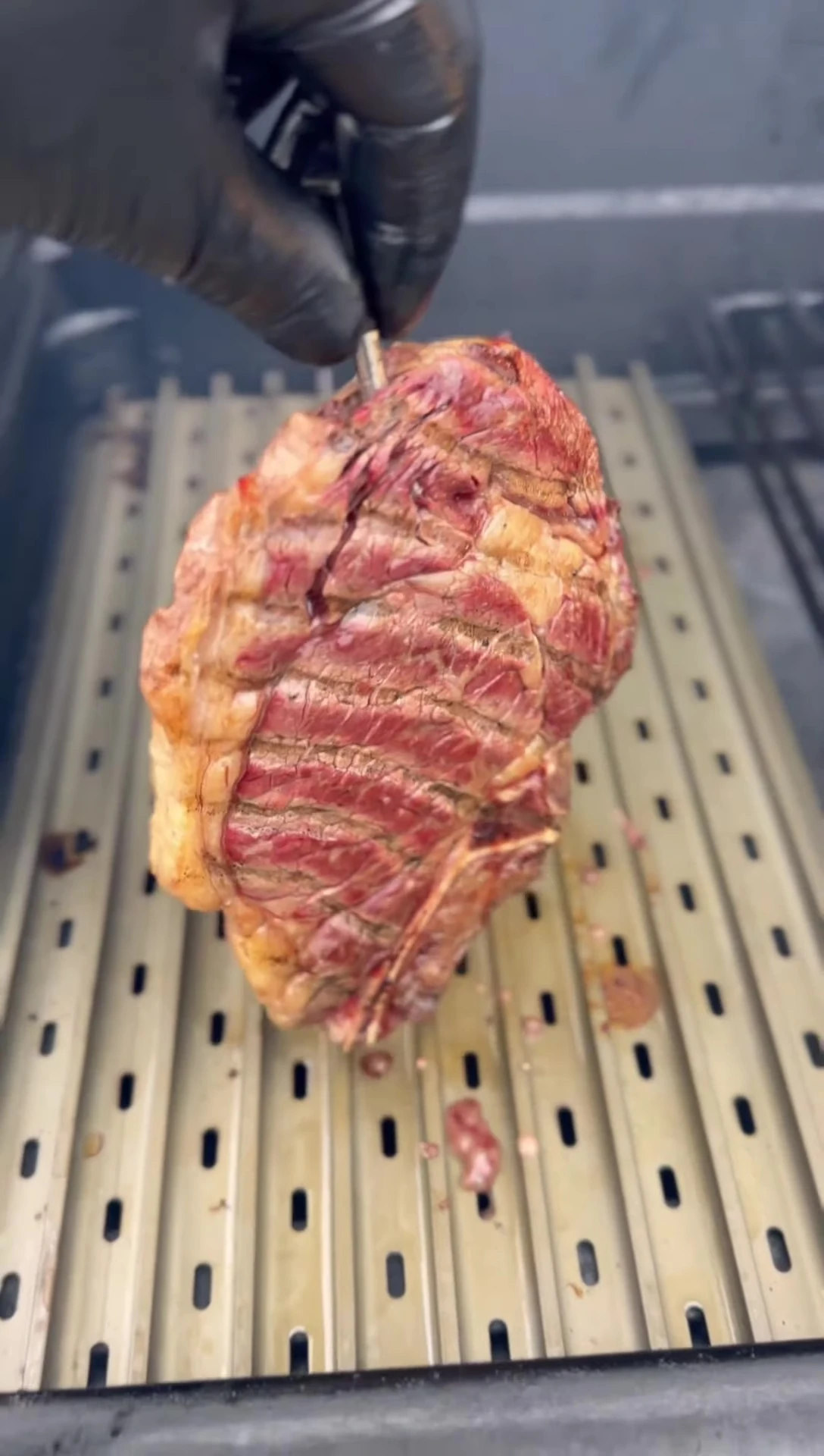 Cross-hatching the steak on the sear grate.
