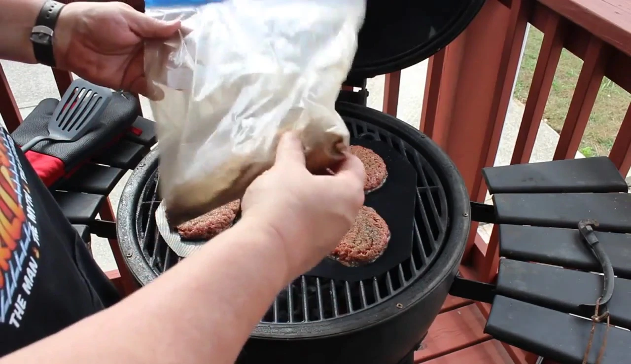 Wood chip dust being added to the grill