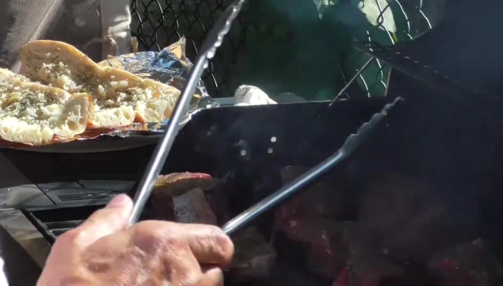 The garlic bread being prepared