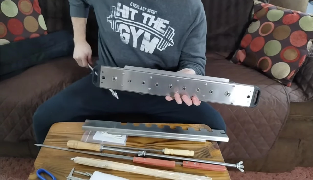 Clamps in place to attach the unit to the grill.