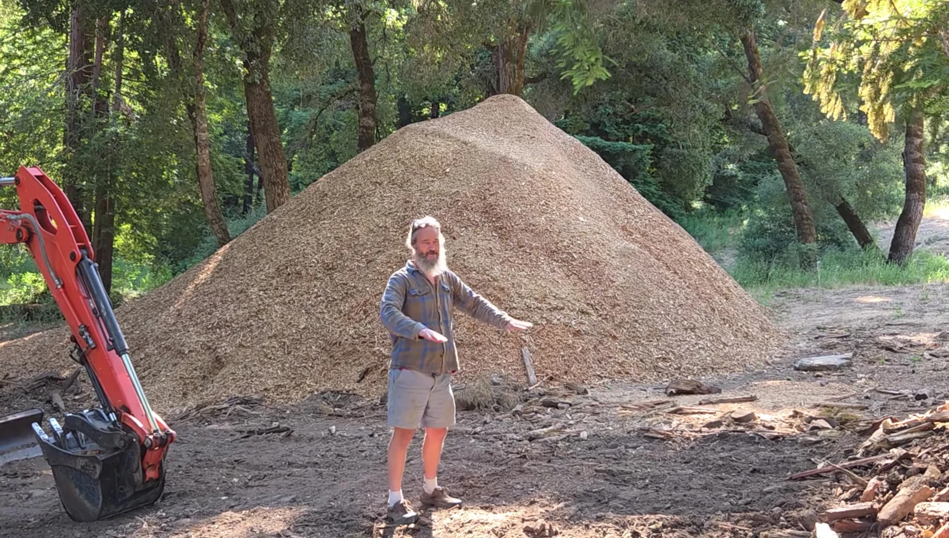 Wood chips being spread on the ground.