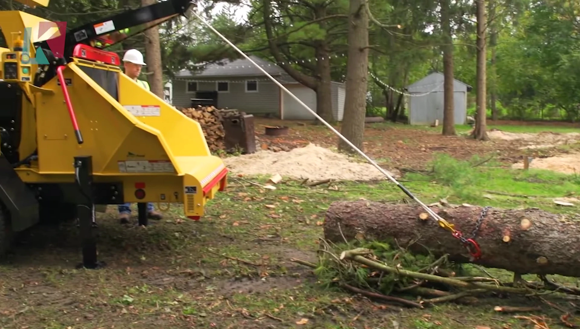 The Vermeer AX19 compact brush chipper showcasing its size and efficiency.