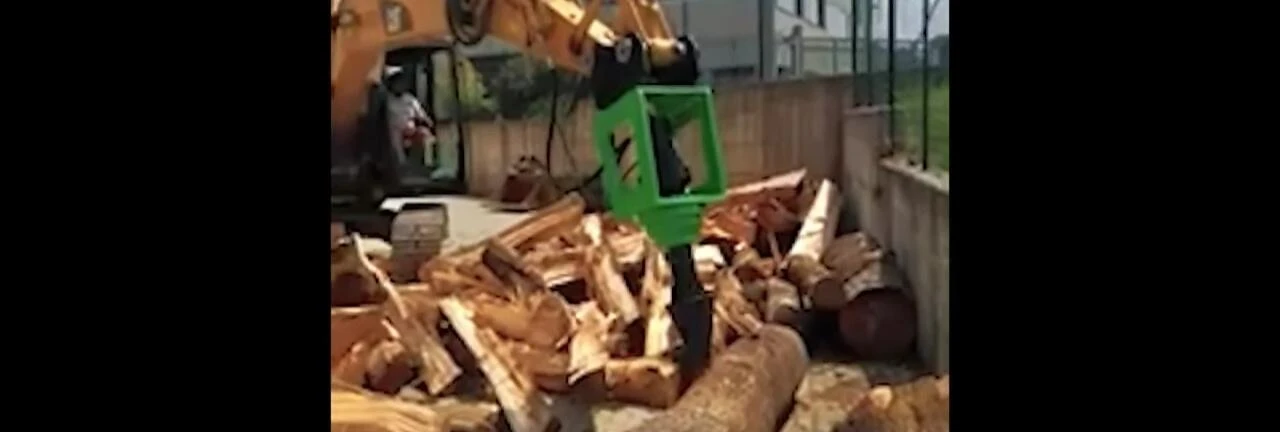 The Caterpillar 312B excavator with a four-head cone drill.
