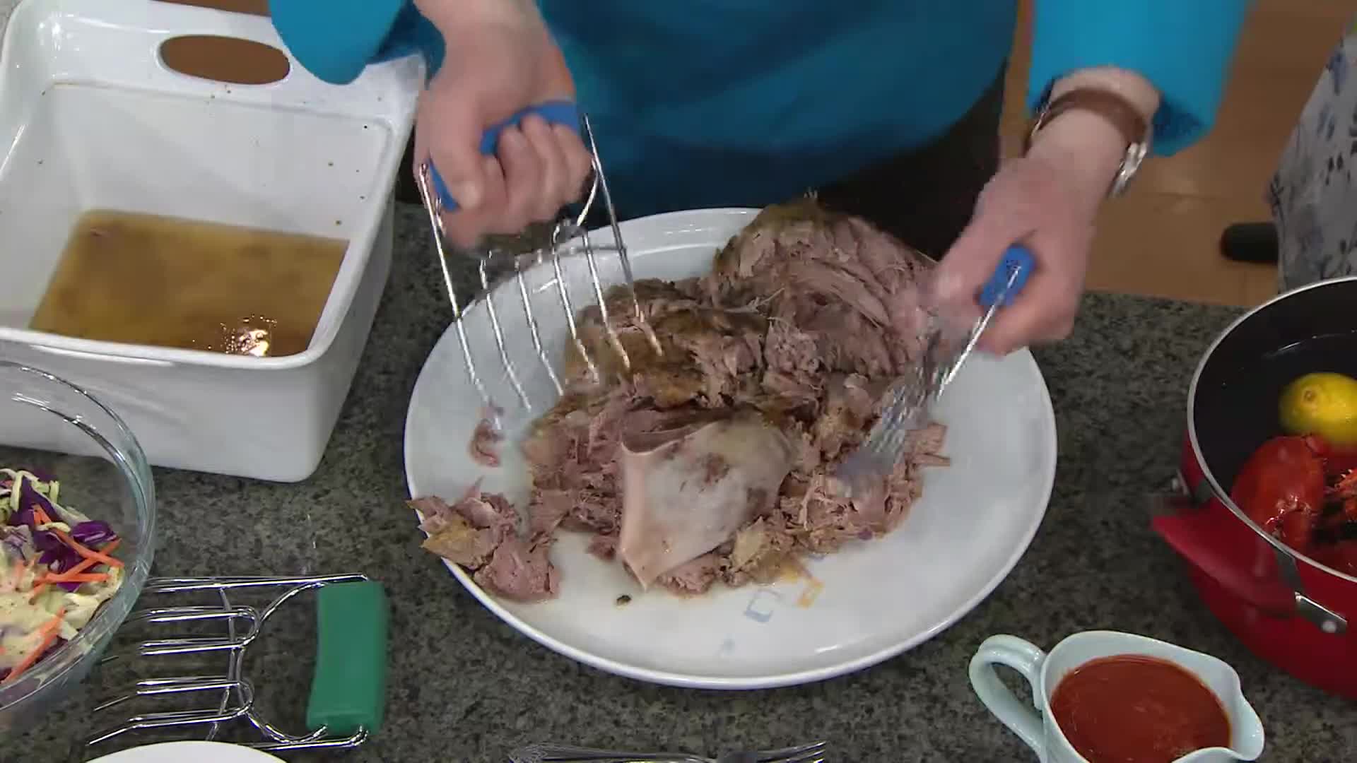 Presenter showcasing the ease of shredding with the claws