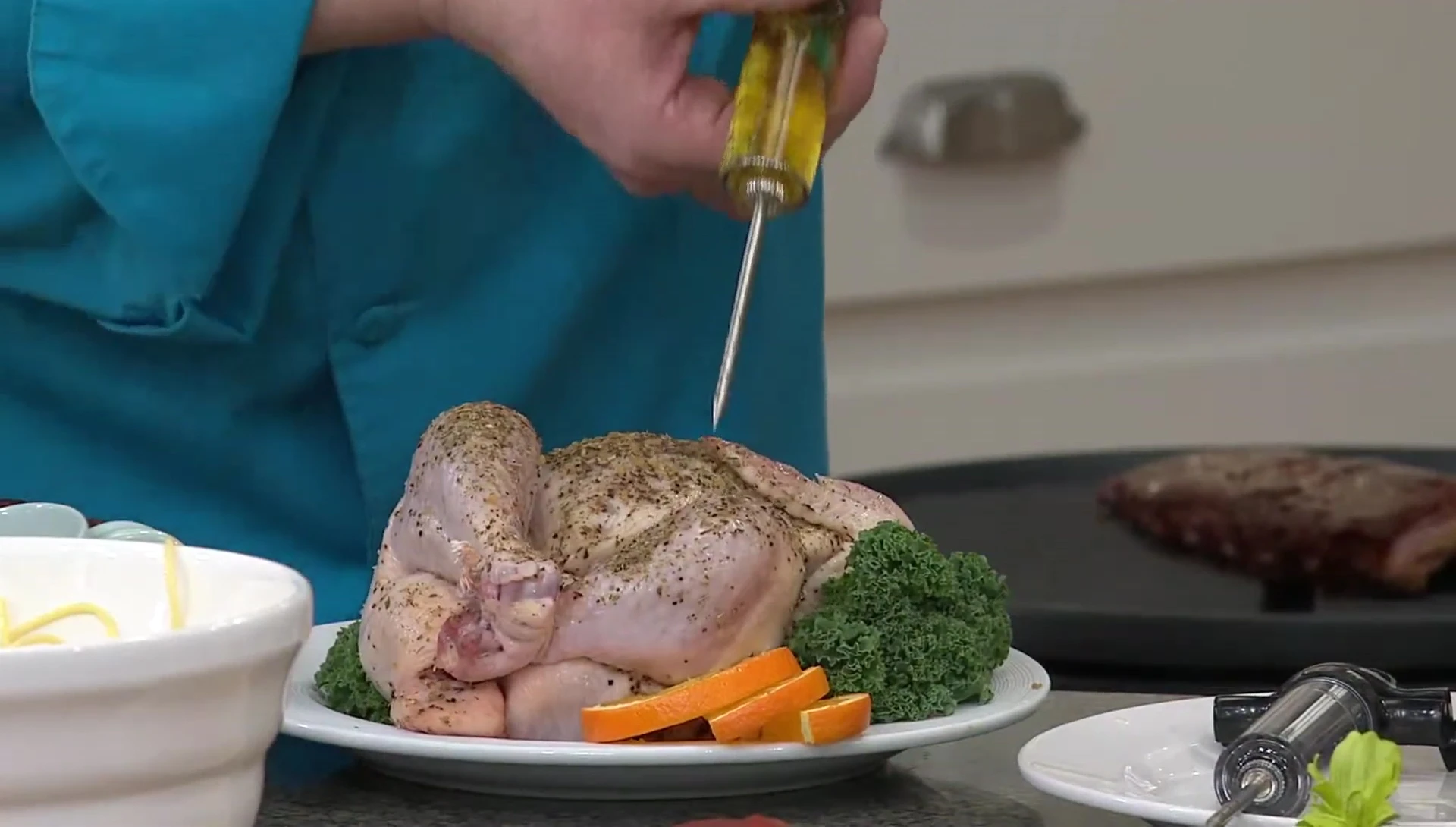 Injector in use, adding marinade to meat