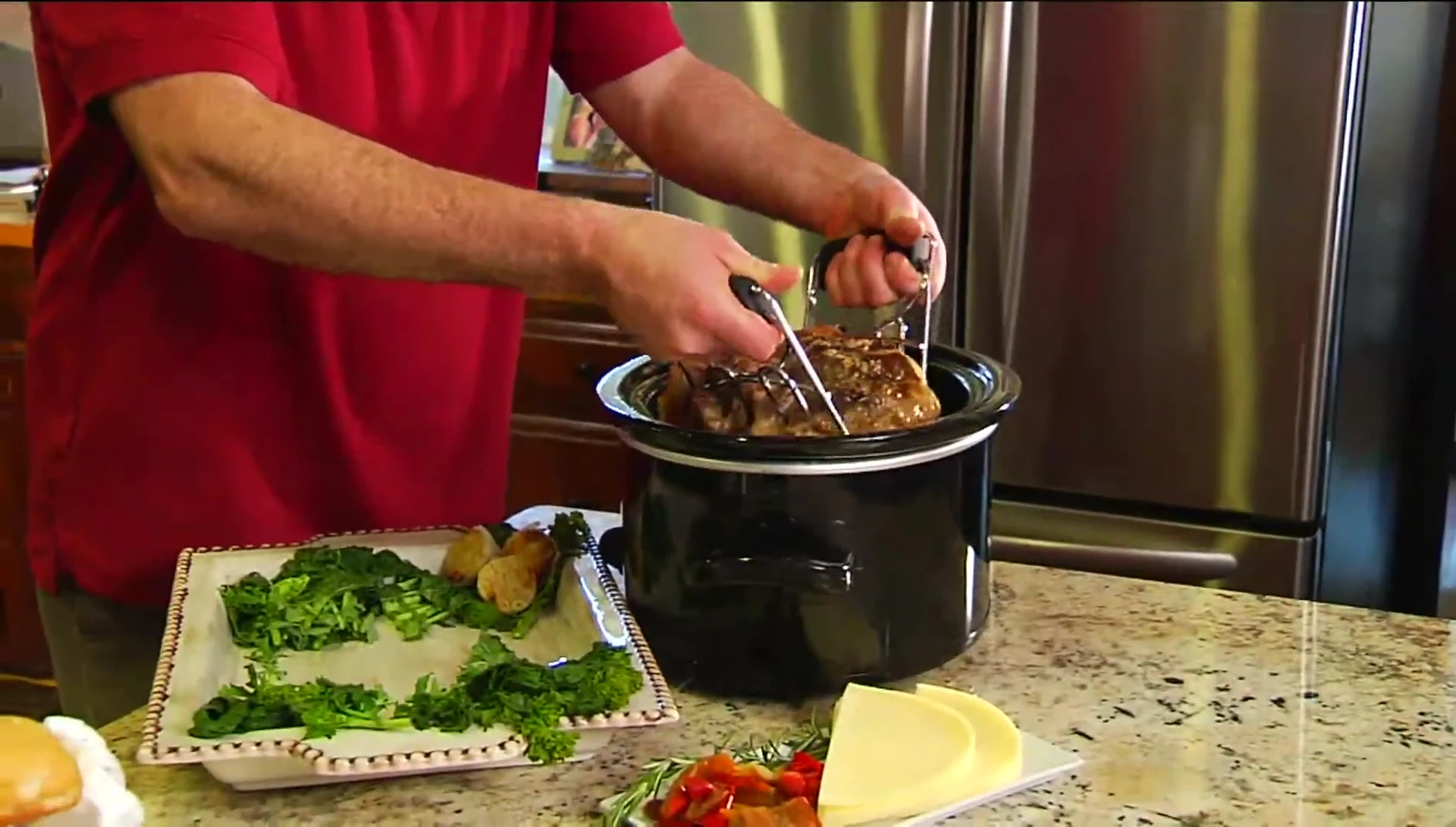 Claws being used to safely remove meat from a crock-pot