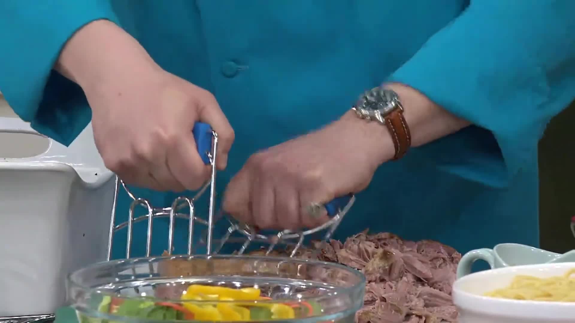 Close-up shot of the grilling claws shredding pork