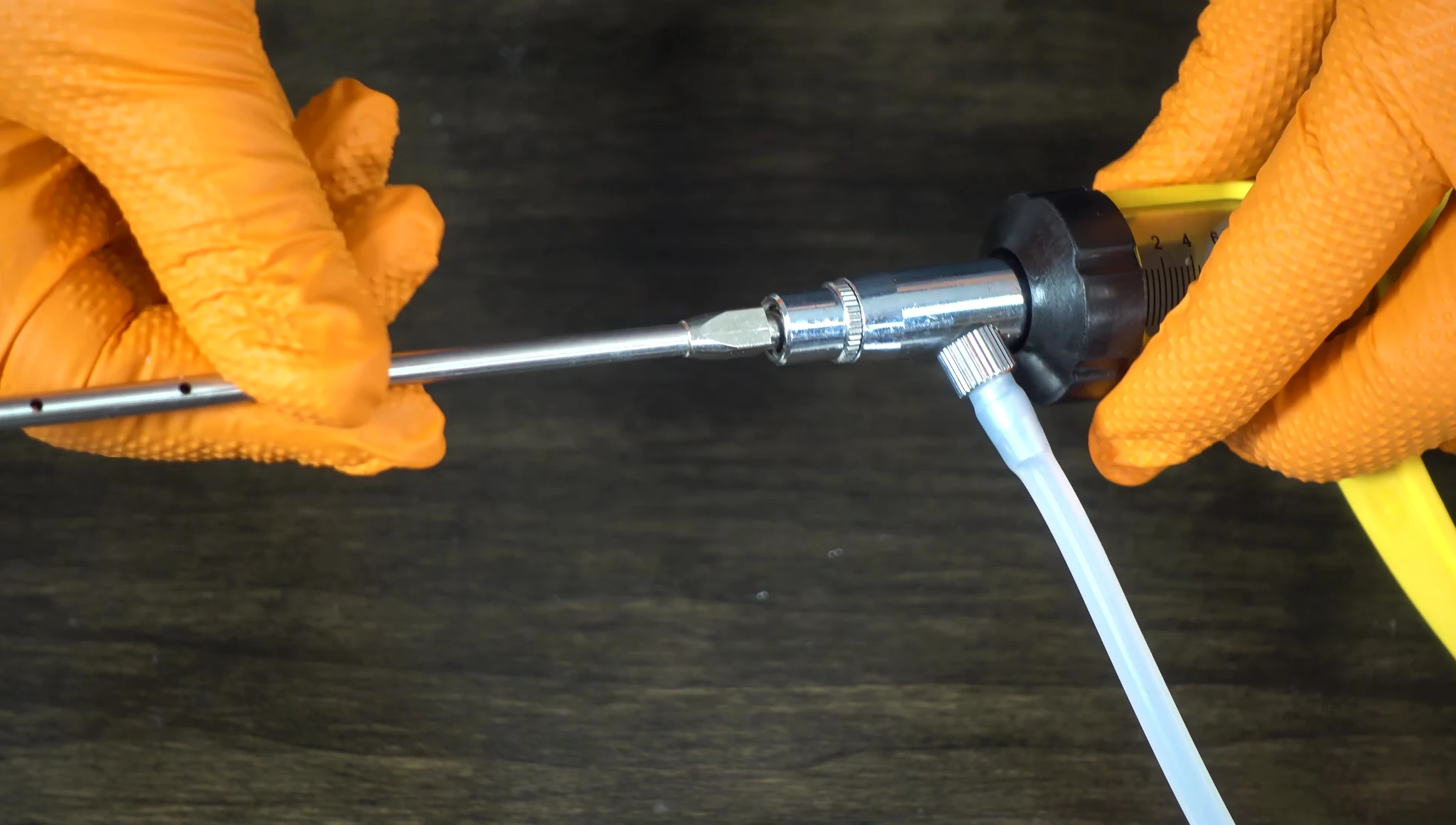 The 27-inch plastic suction tube and the injector unit.