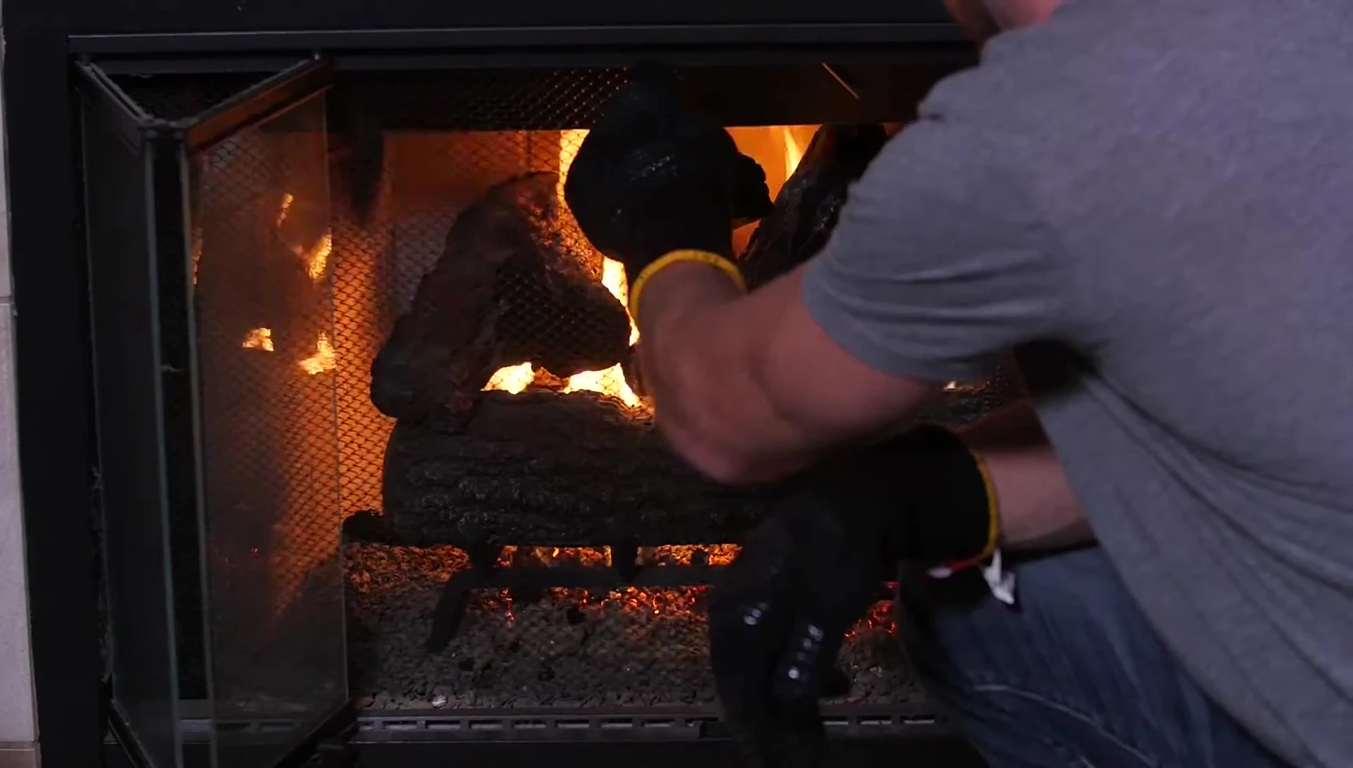 The mitt in use near a grill