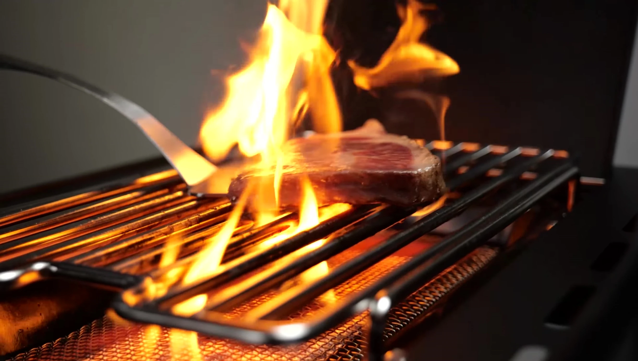 The sizzle zone in use while searing a steak.