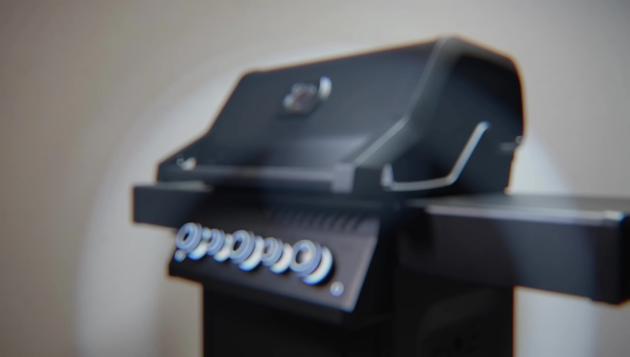 Close-up of the Napoleon Phantom grill, showcasing its sleek black finish.