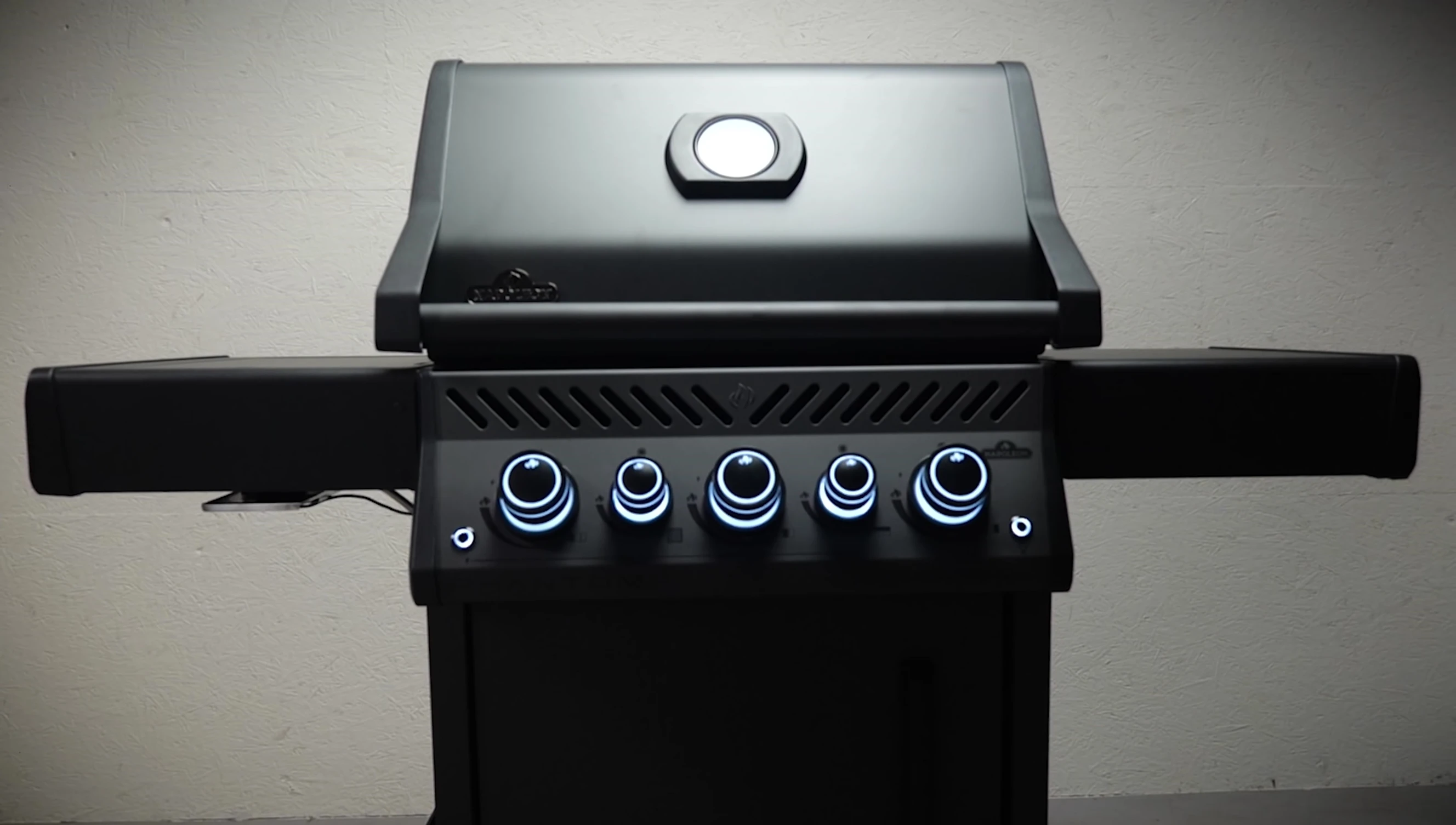 The grill being admired in a studio setting.