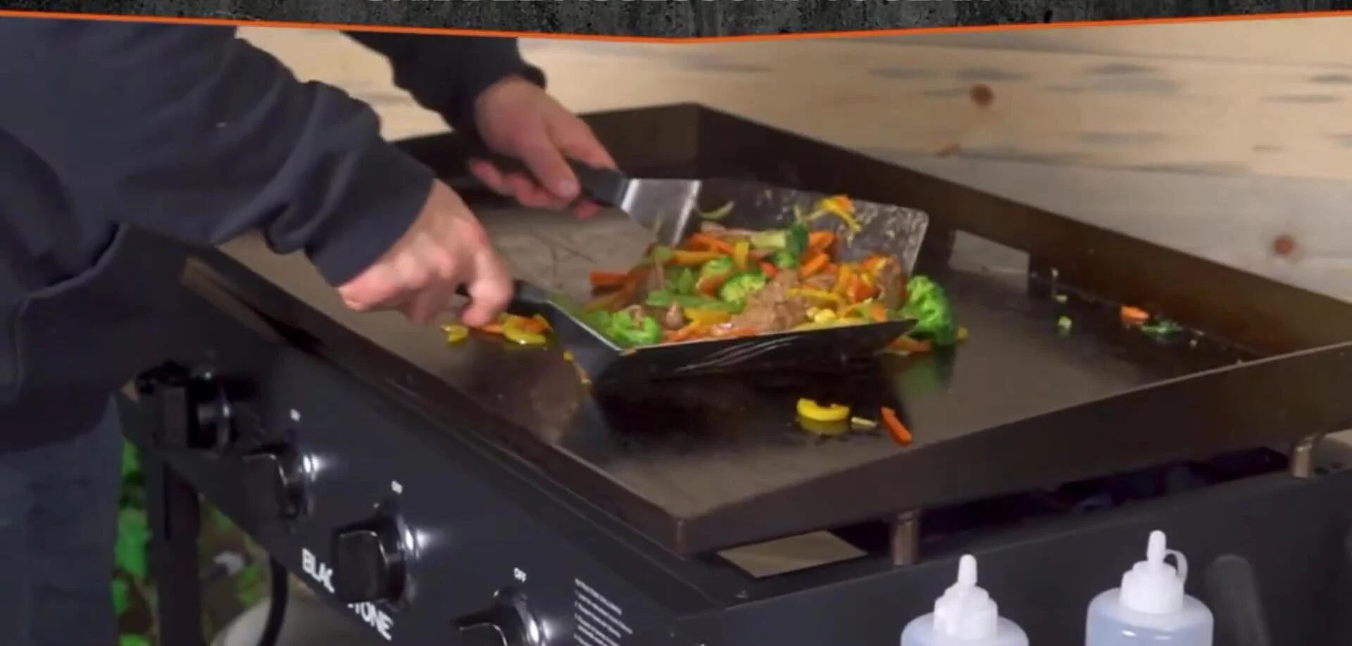 Close-up showing the oversized spatulas and comfortable handles.