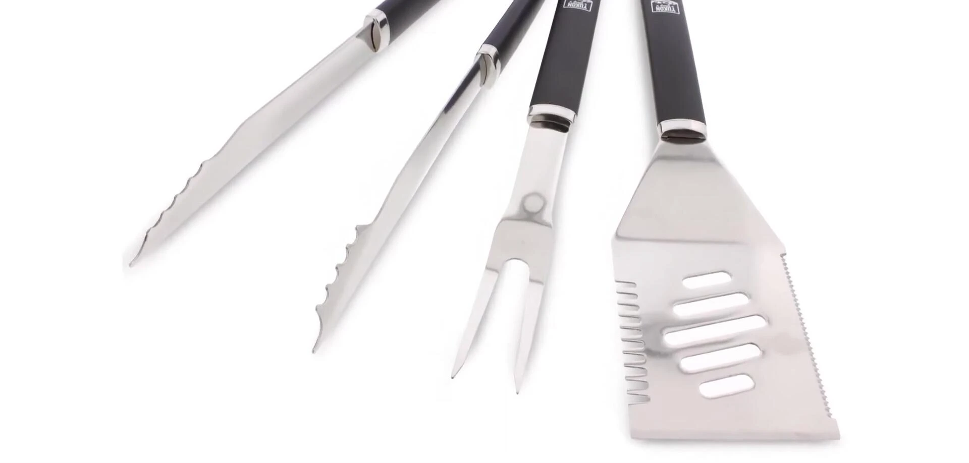 Close-up shot of the serrated edges of the fork and tongs.