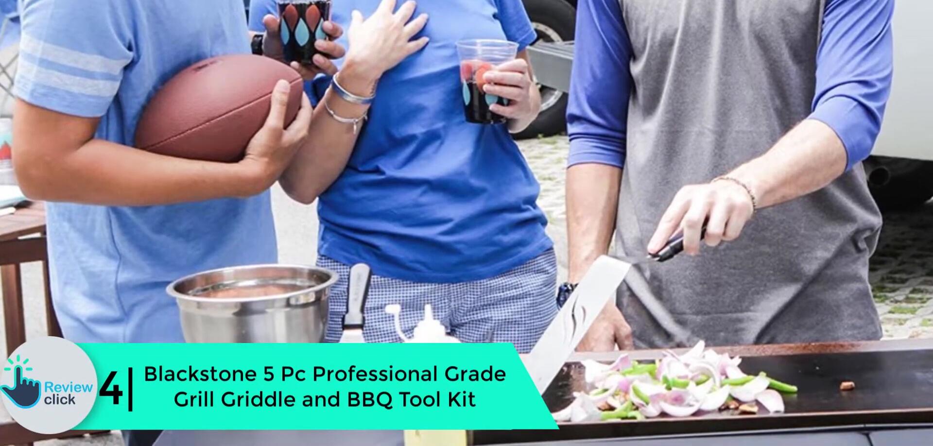 The Blackstone 5-piece grill tool set displayed on a grill.