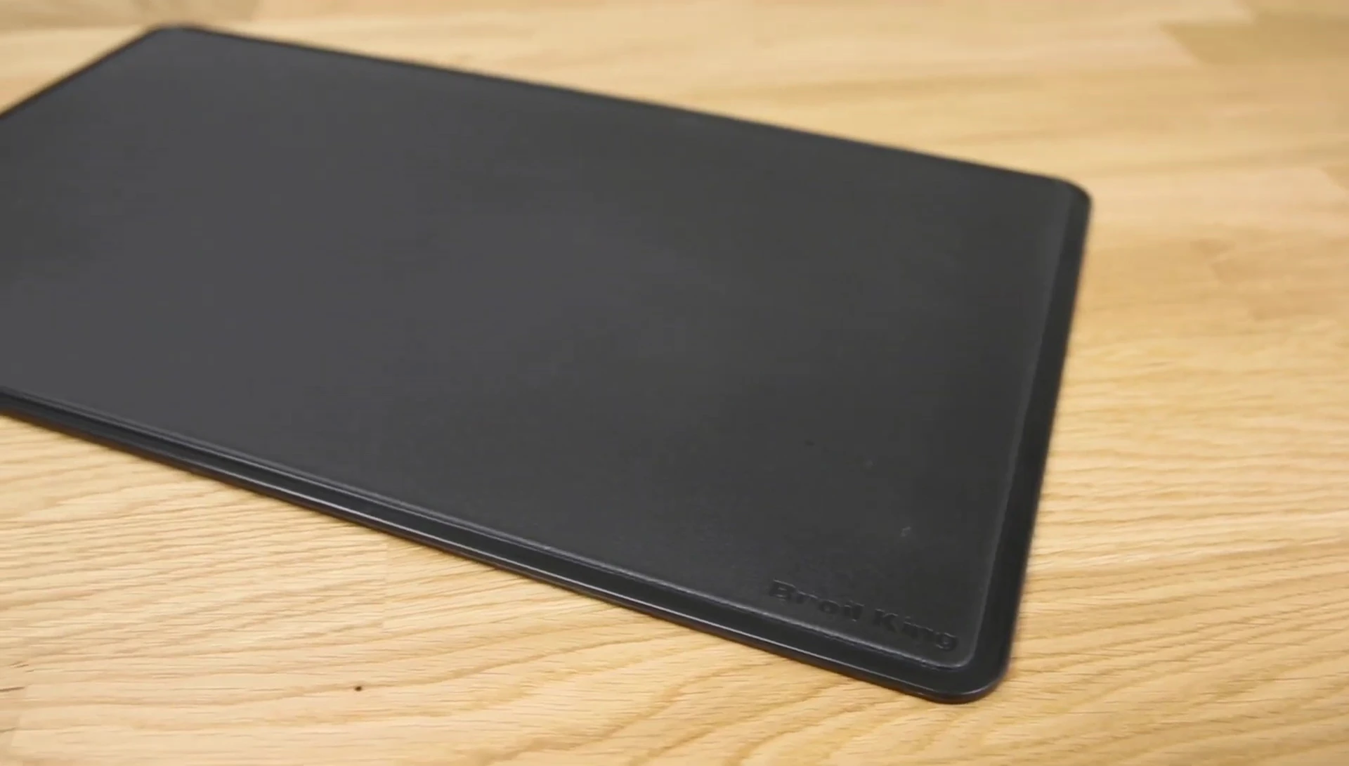 The double-sided cutting board within the tray.