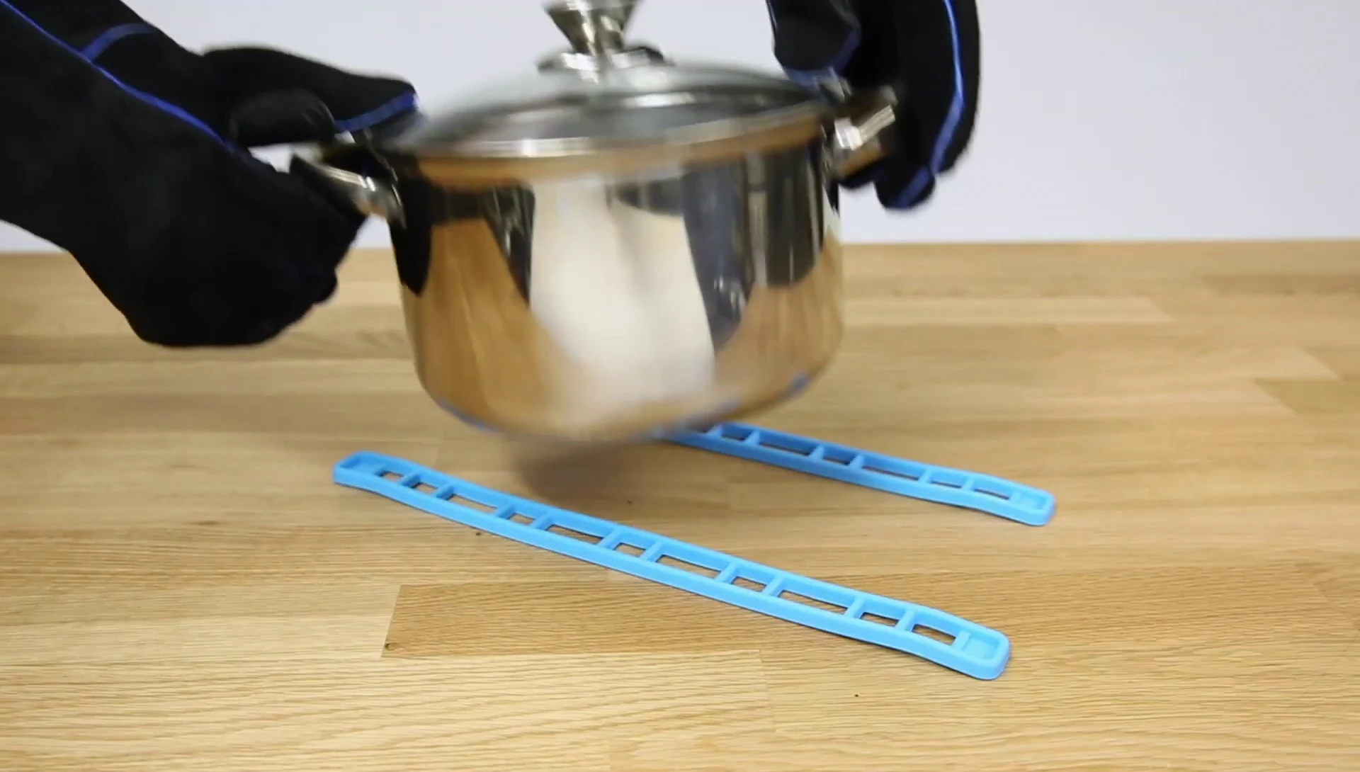 Silicone straps demonstrated as a trivet.