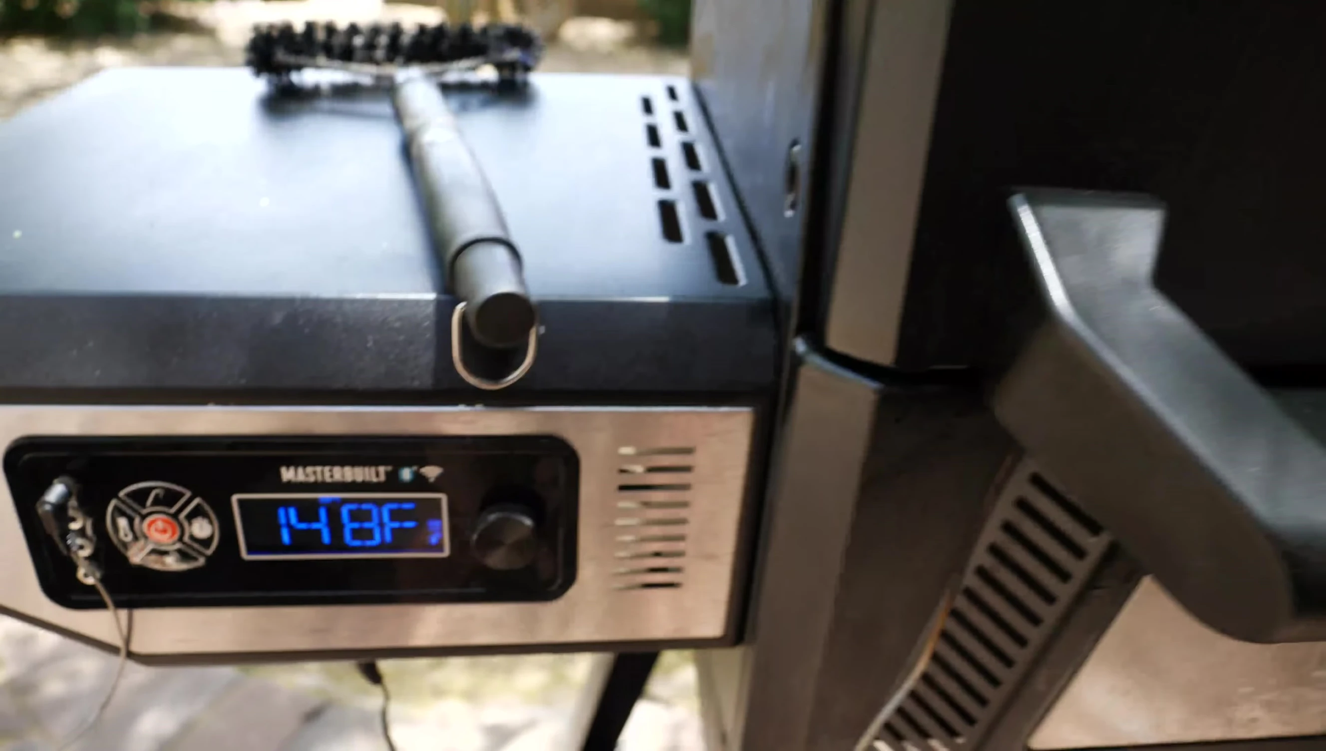 Checking the internal temperature of the Masterbuilt.